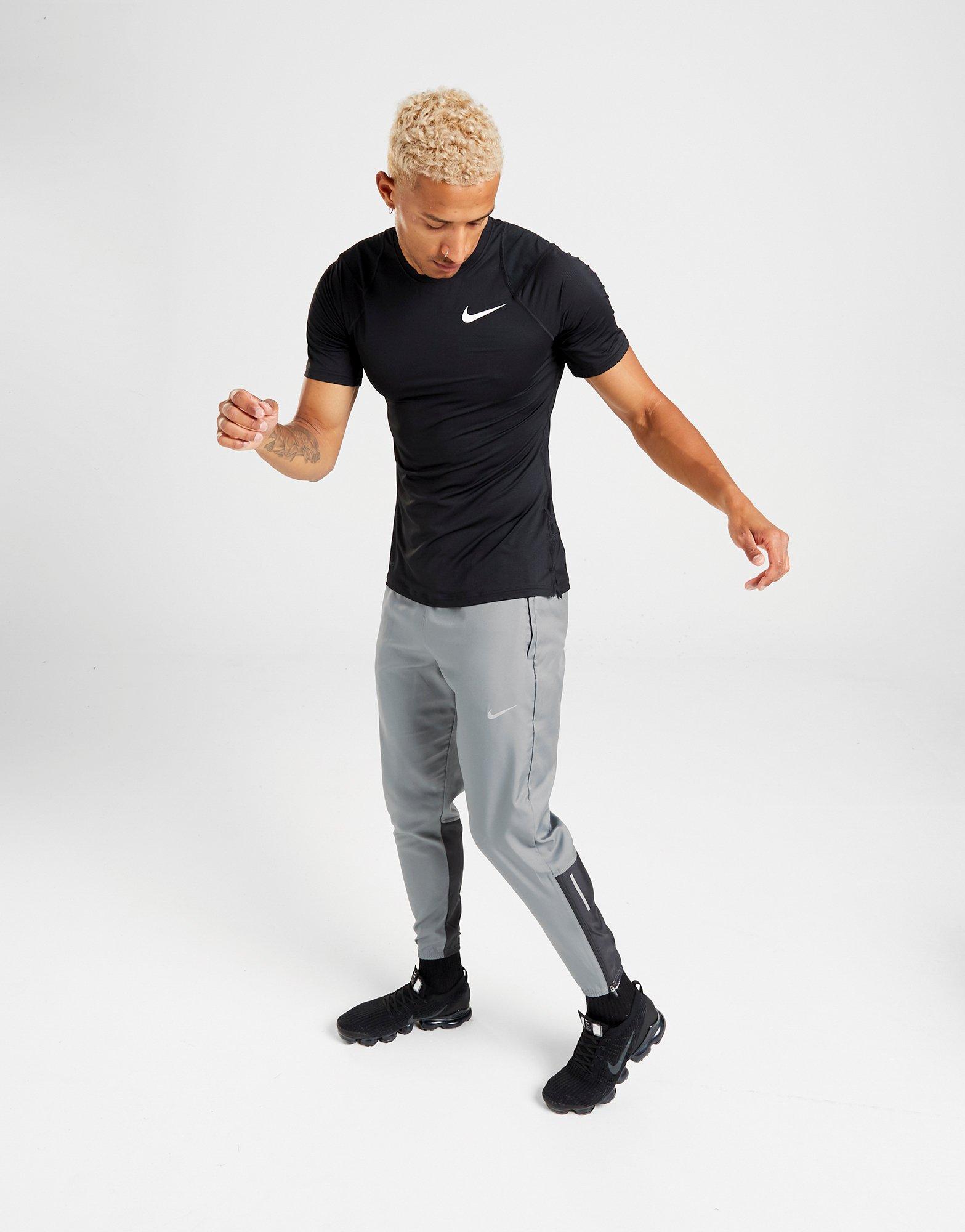 nike essential woven track pants