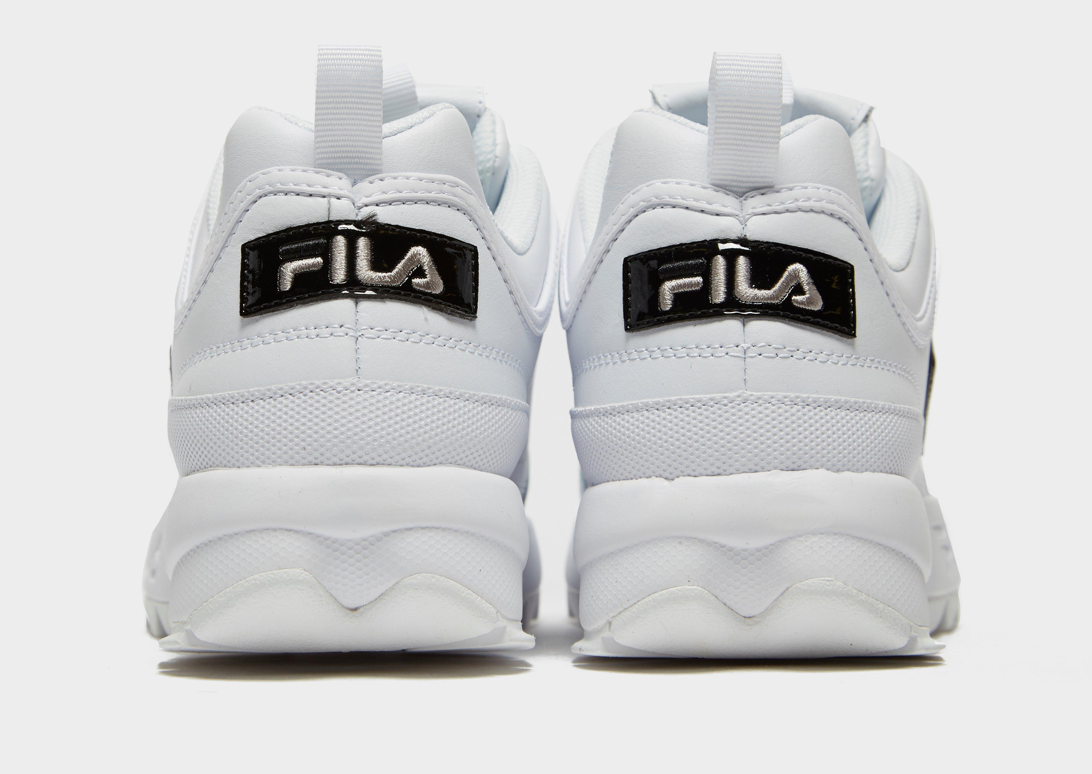 grey and pink fila disruptor