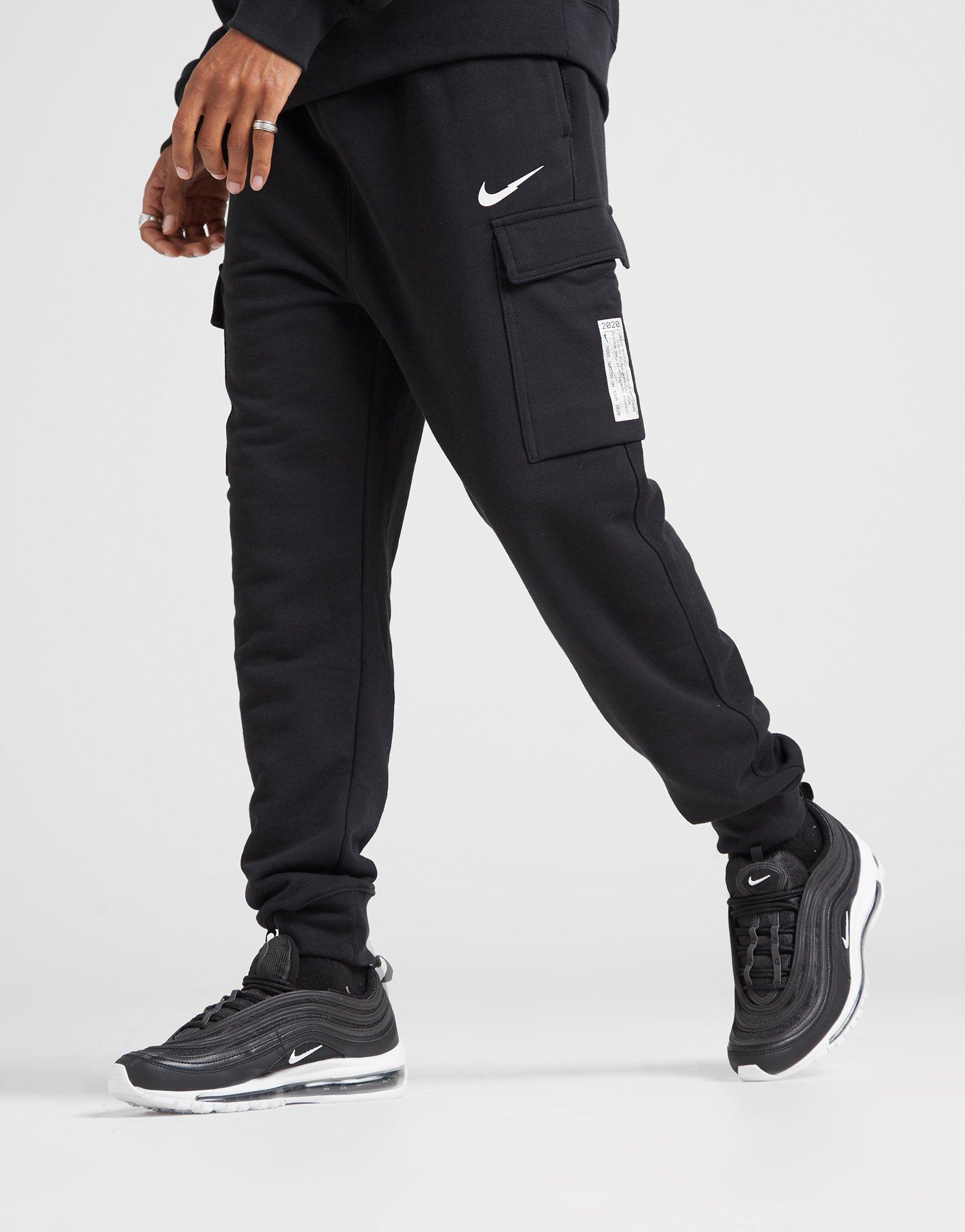 nike swoosh on tour pack cuffed cargo joggers