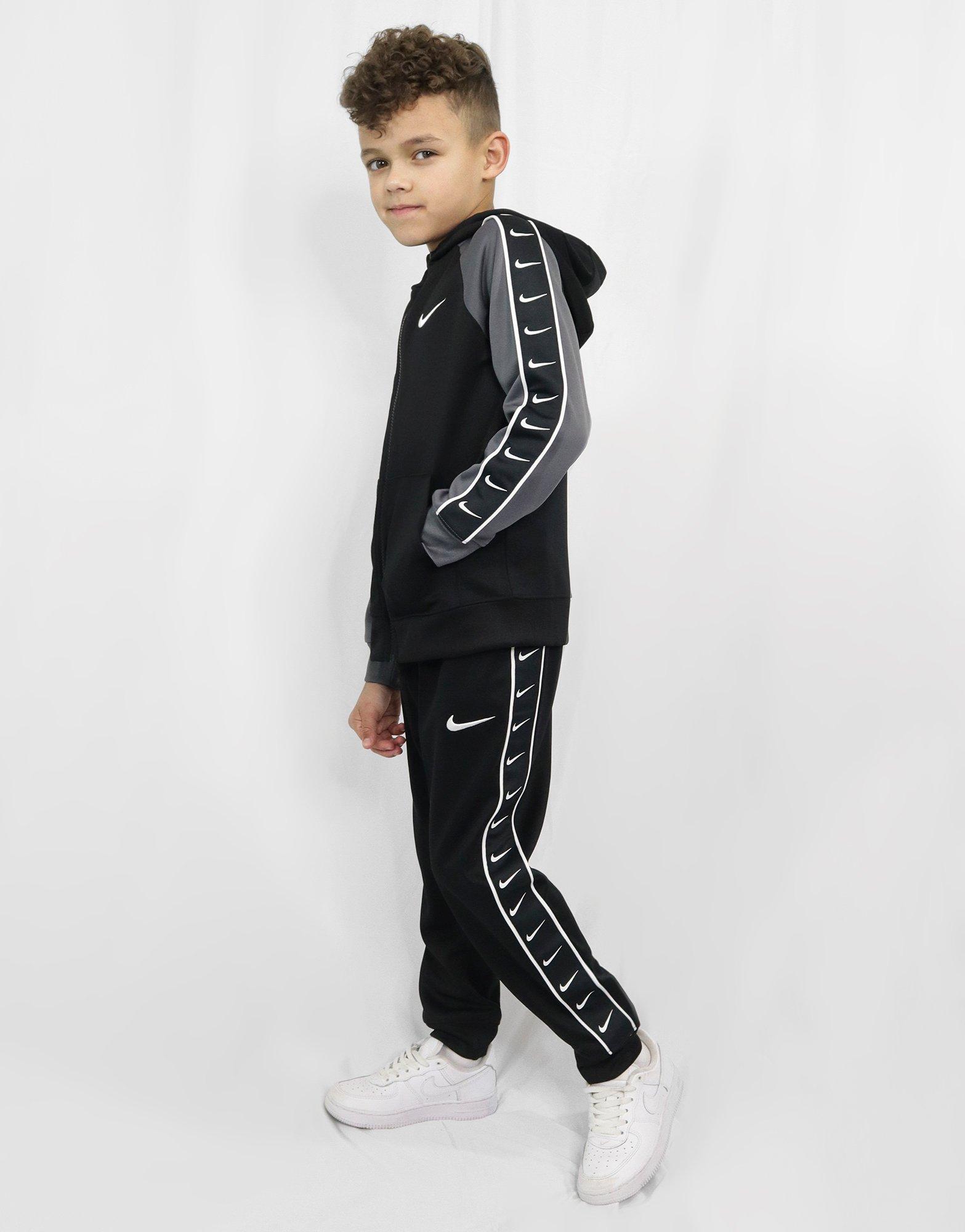 grey nike swoosh tracksuit