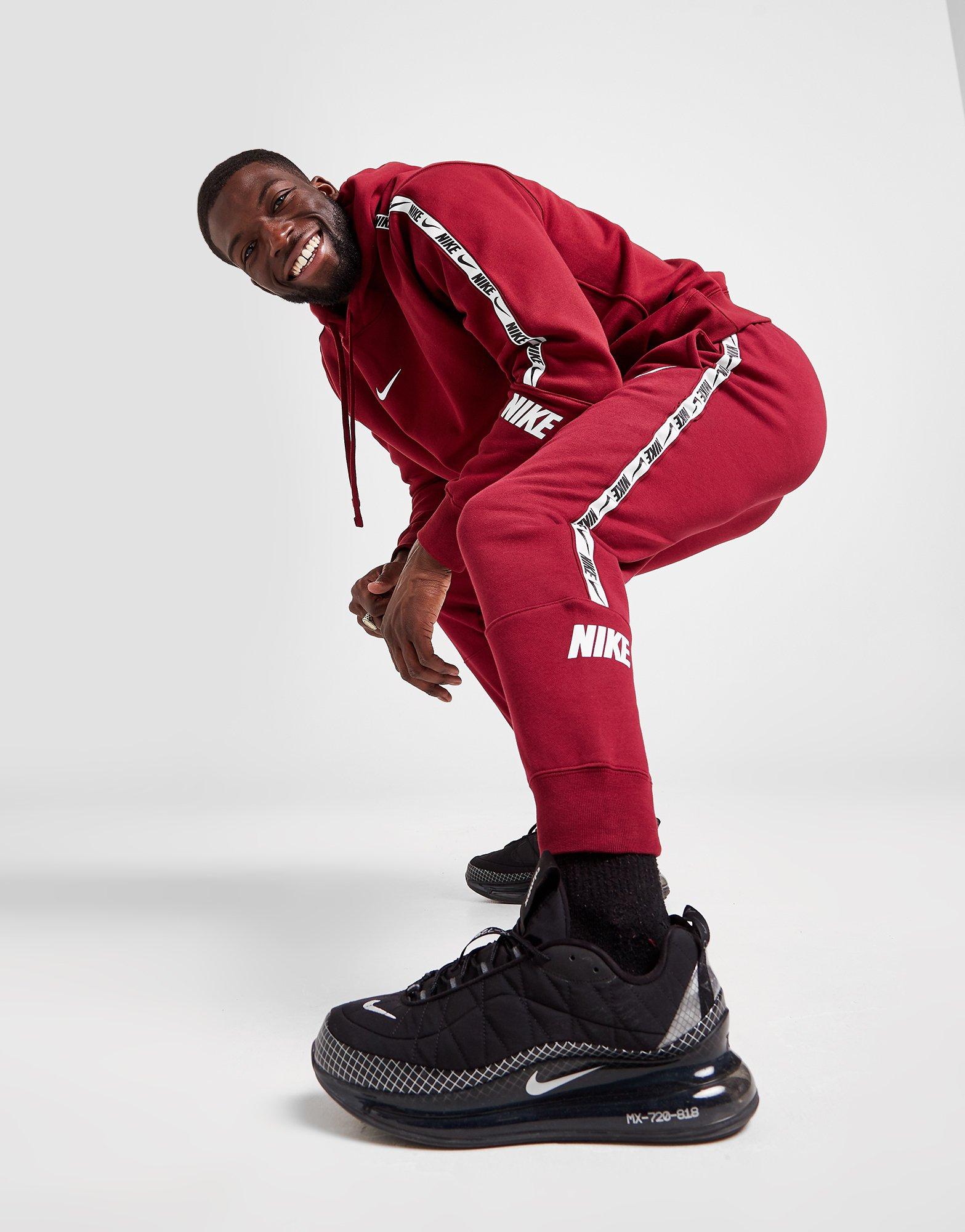 nike tape track pants red