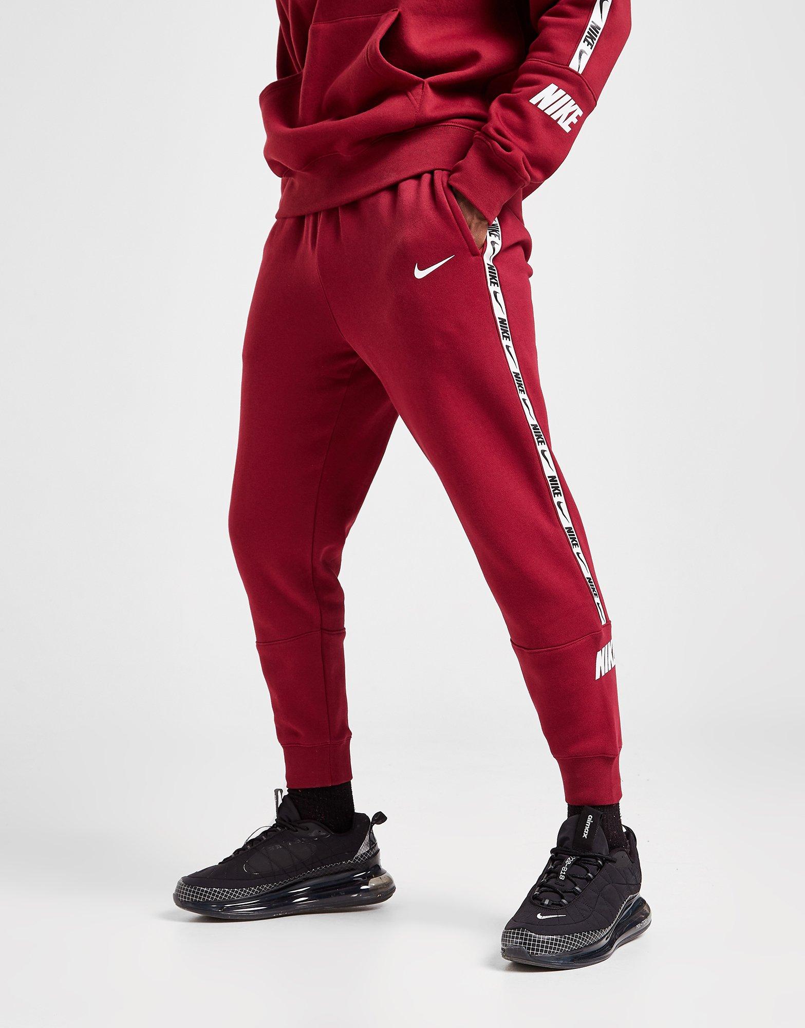 red nike tape joggers