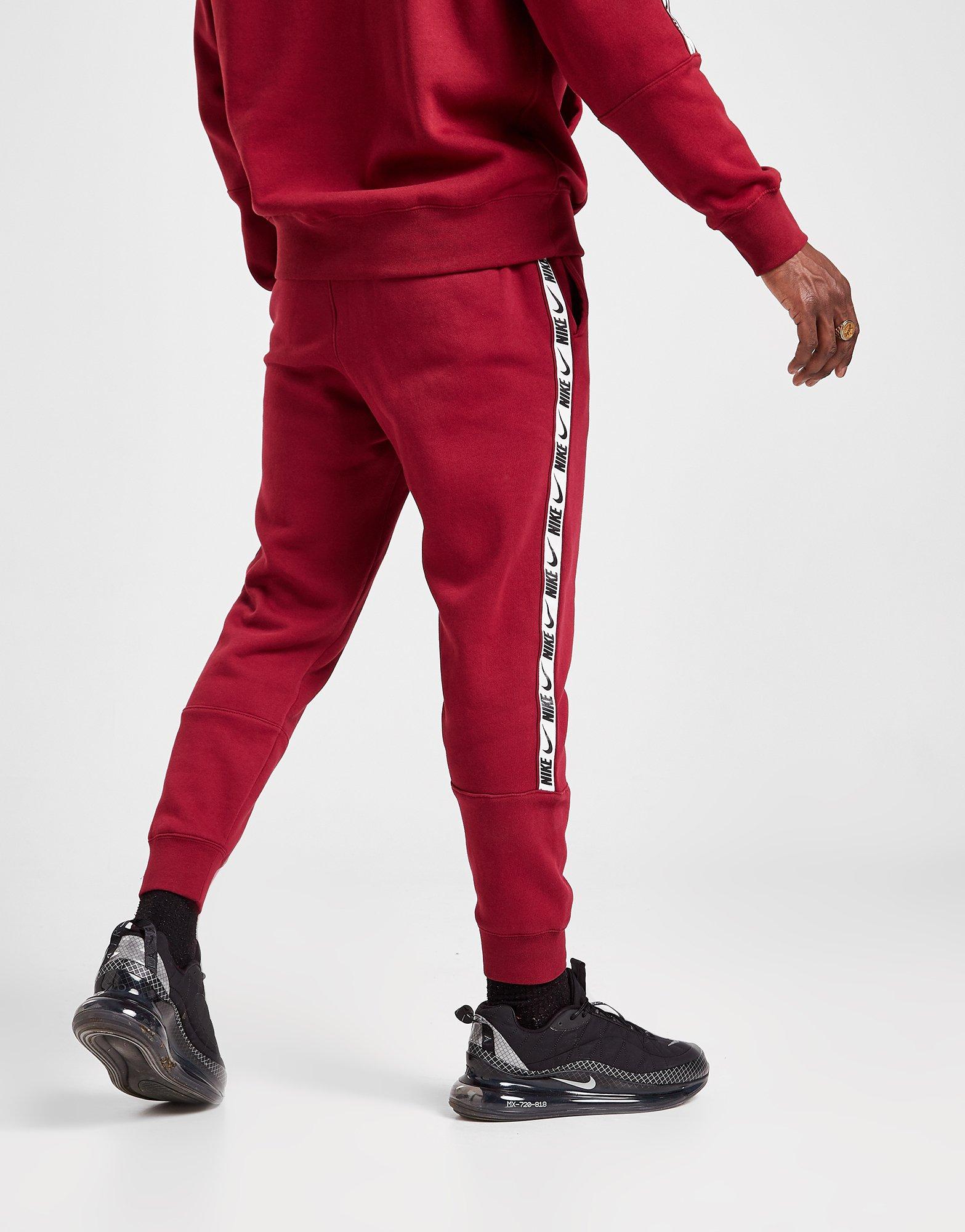 red nike tape joggers