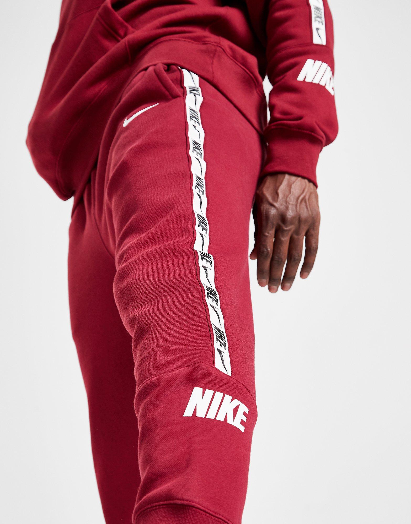 red nike tape joggers