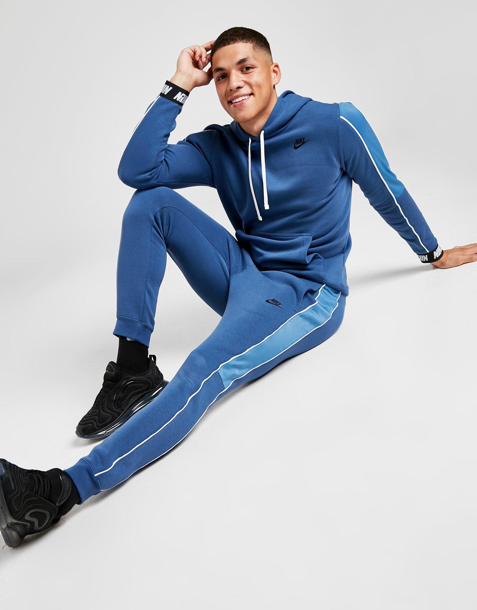 blue nike hybrid tracksuit