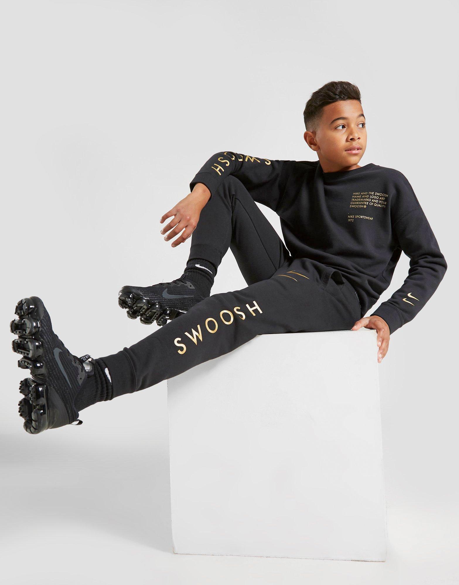 nike swoosh junior