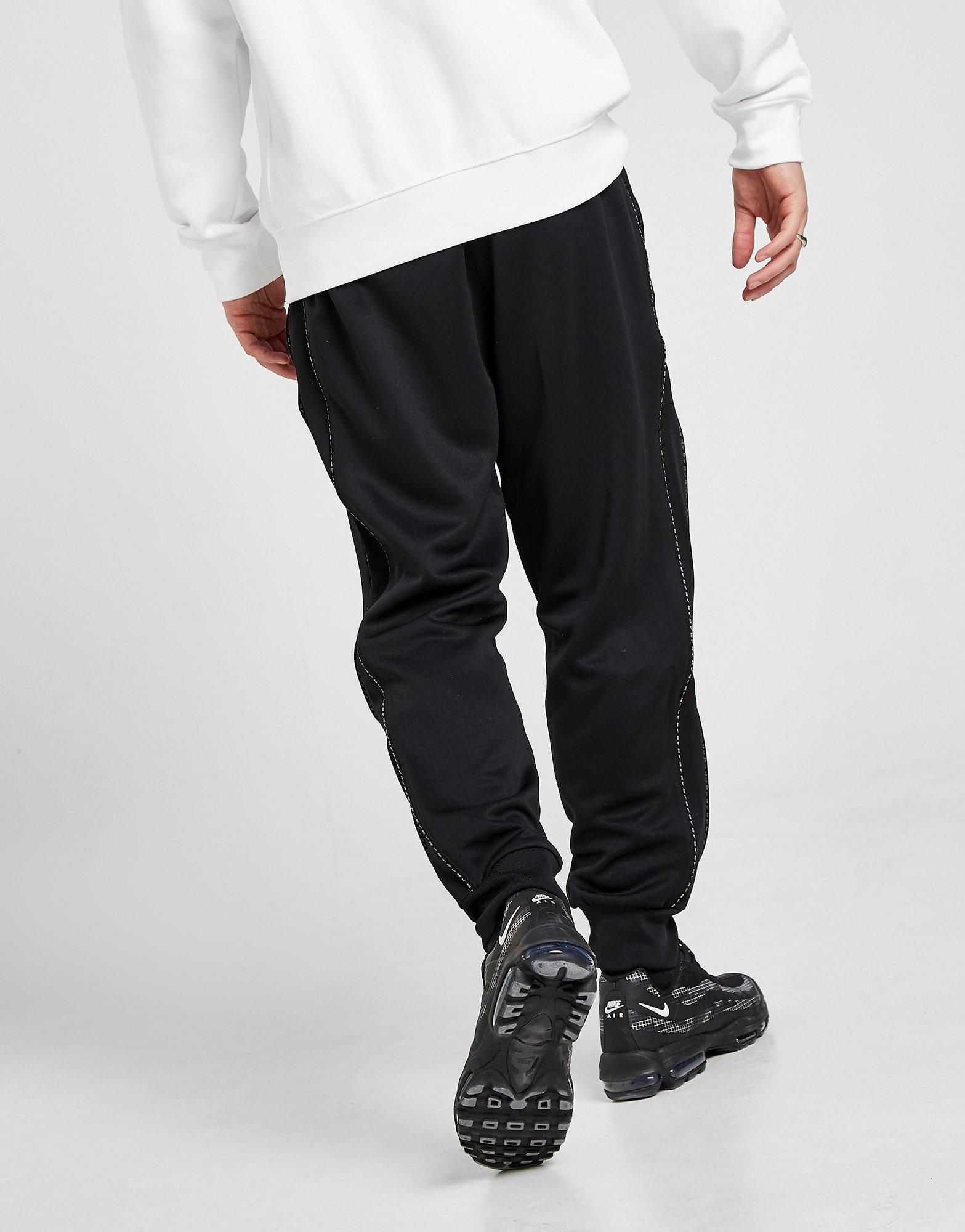 nike repeat tape track pants