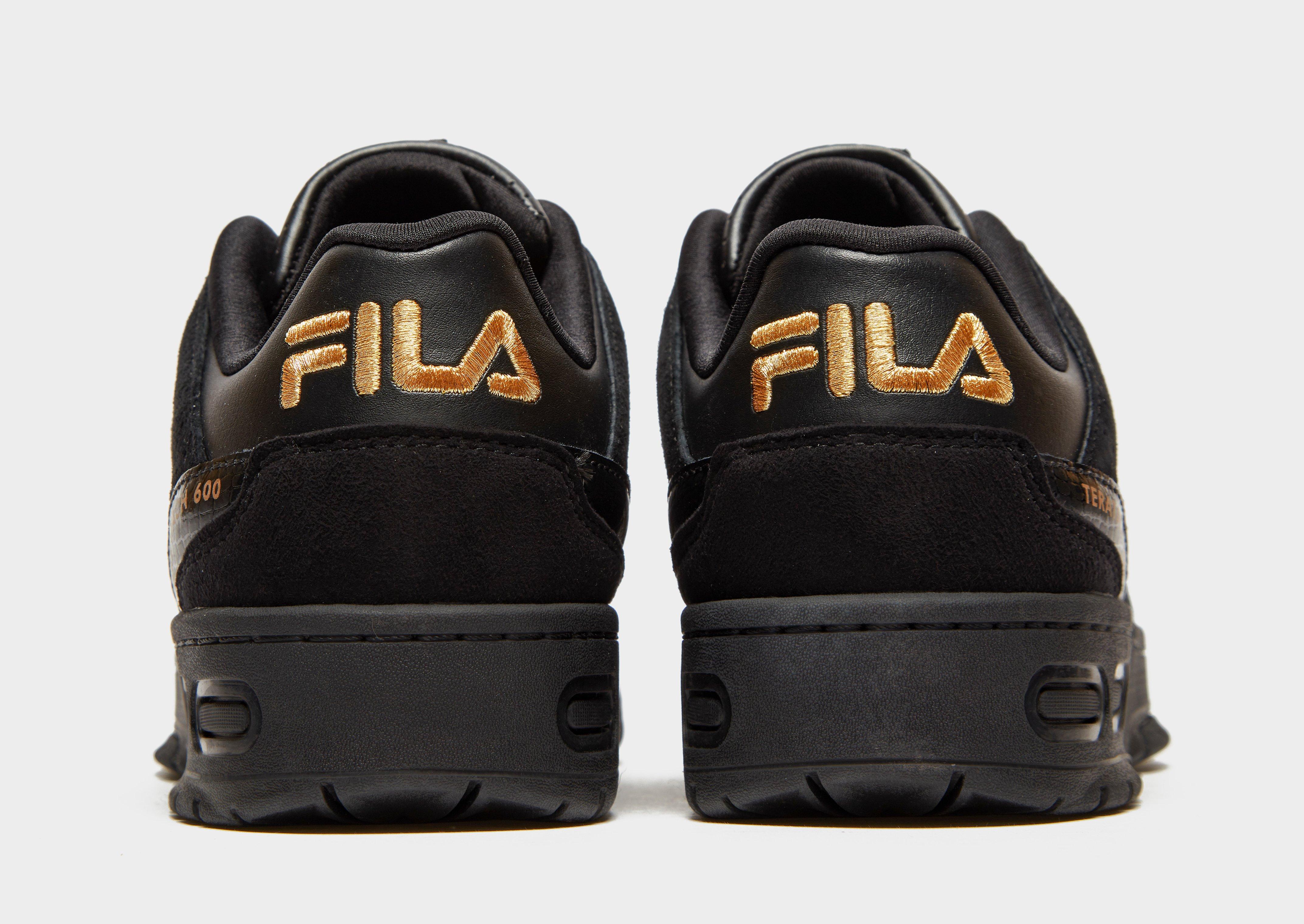 sapatilhas fila pretas e douradas