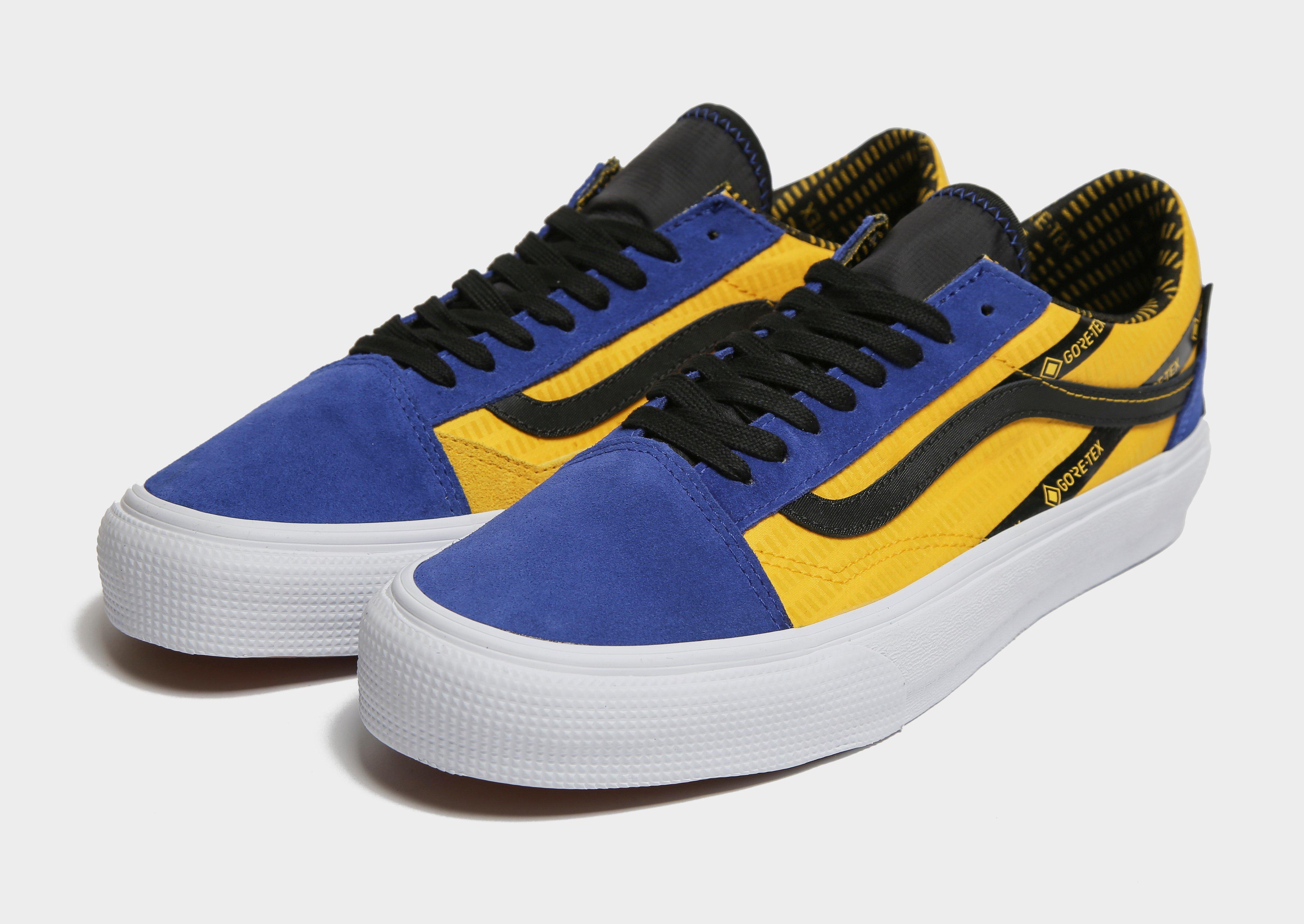 yellow and blue old skool vans