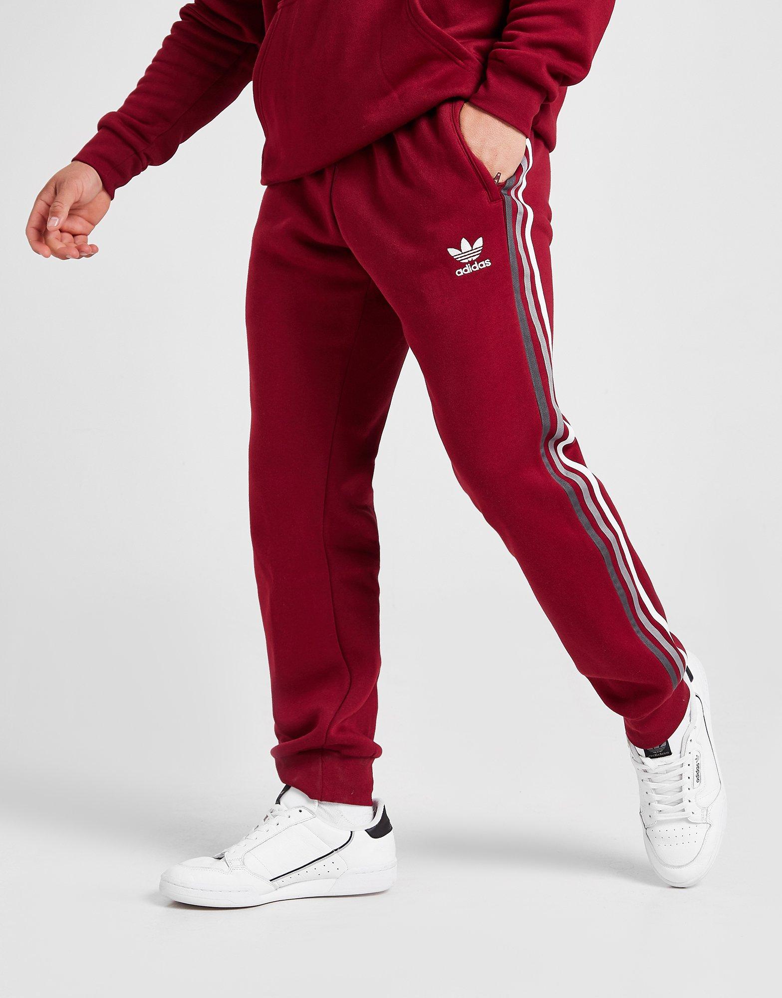 adidas track pants with red stripes