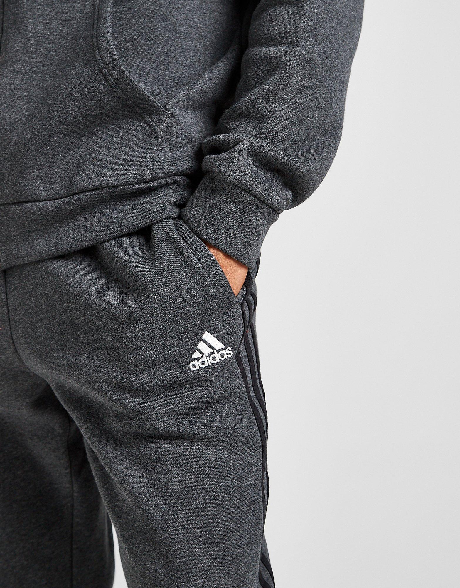 Grey adidas joggers hot sale with black stripes