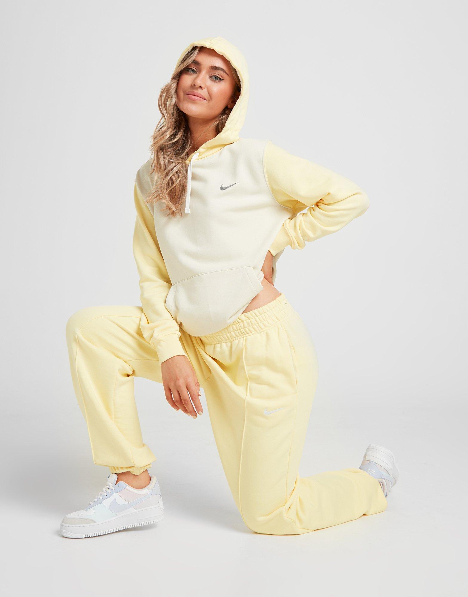 nike mini metallic swoosh oversized joggers in yellow