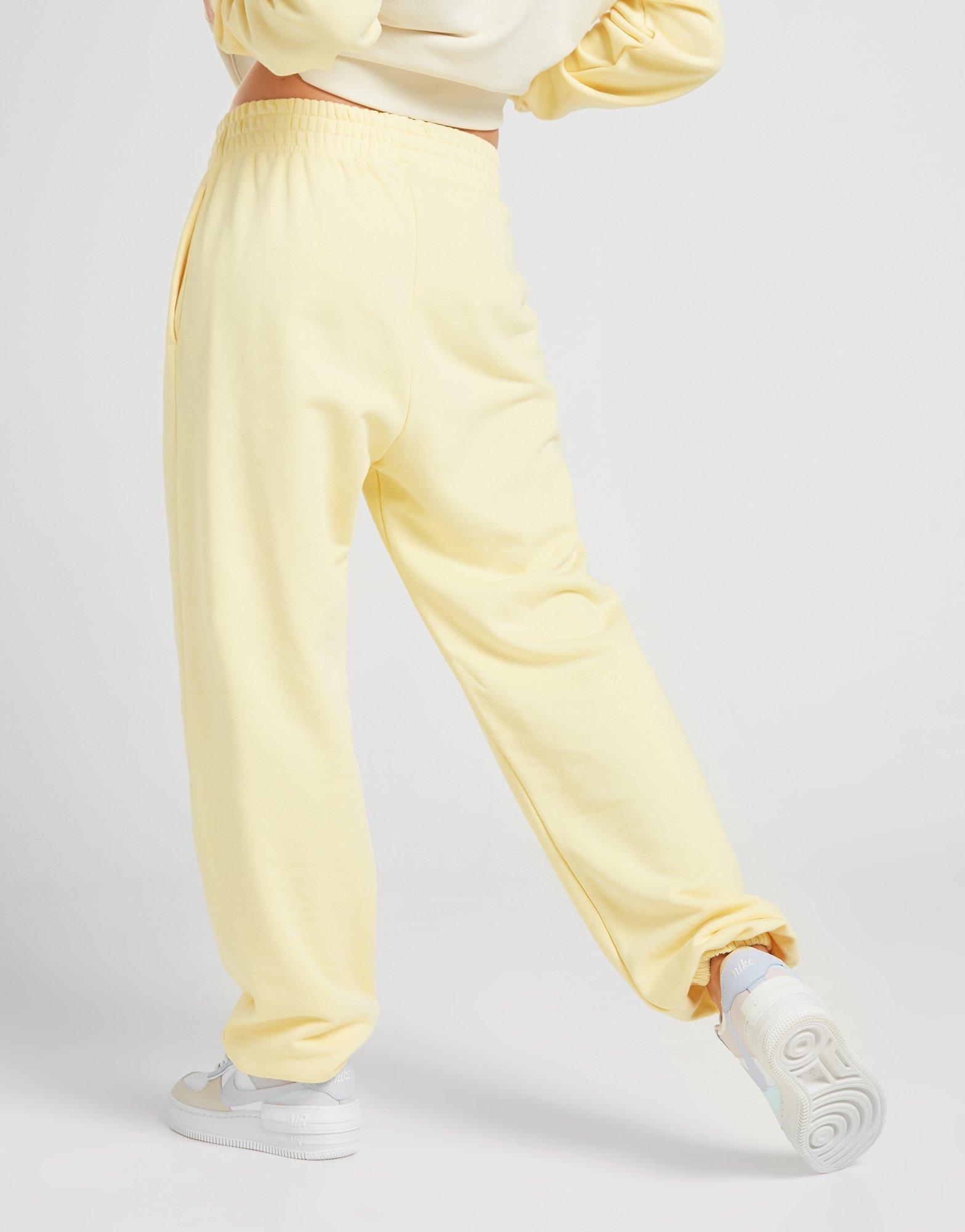 nike mini swoosh oversized yellow joggers