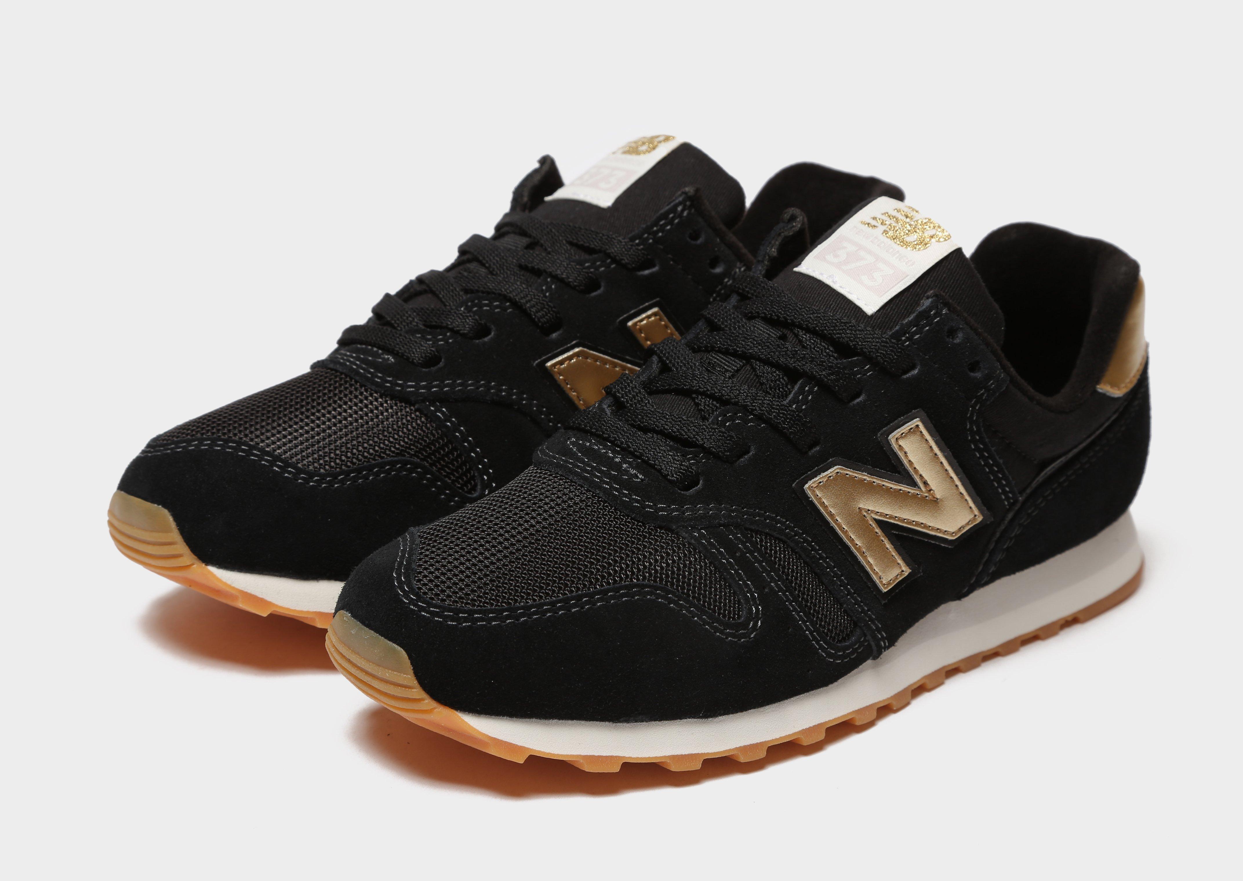 new balance 373 womens black and gold