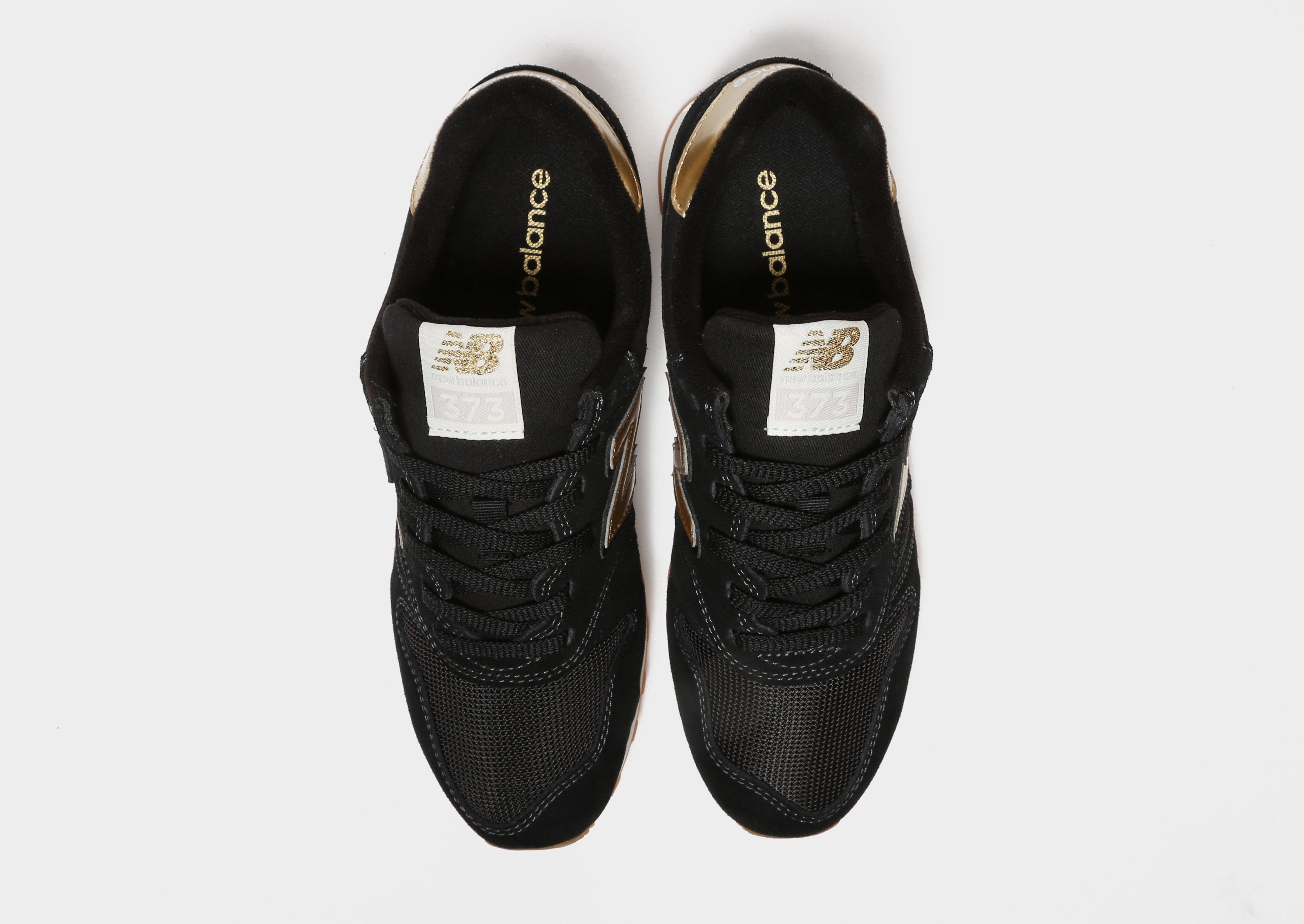 new balance 373 triple black