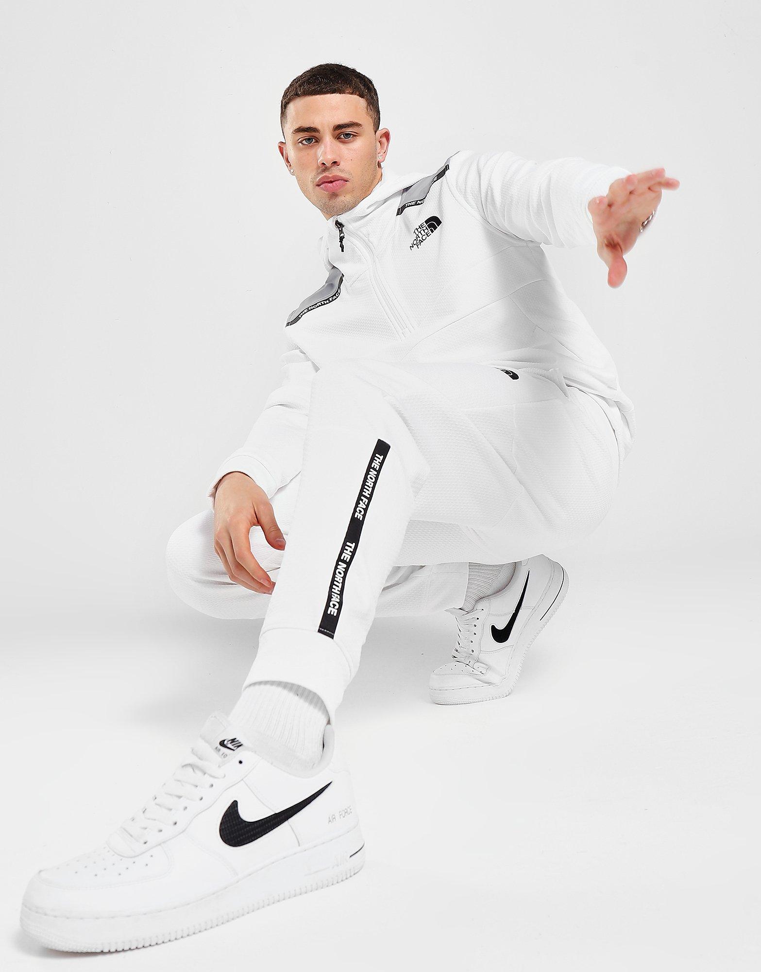 the north face train n logo track pants white