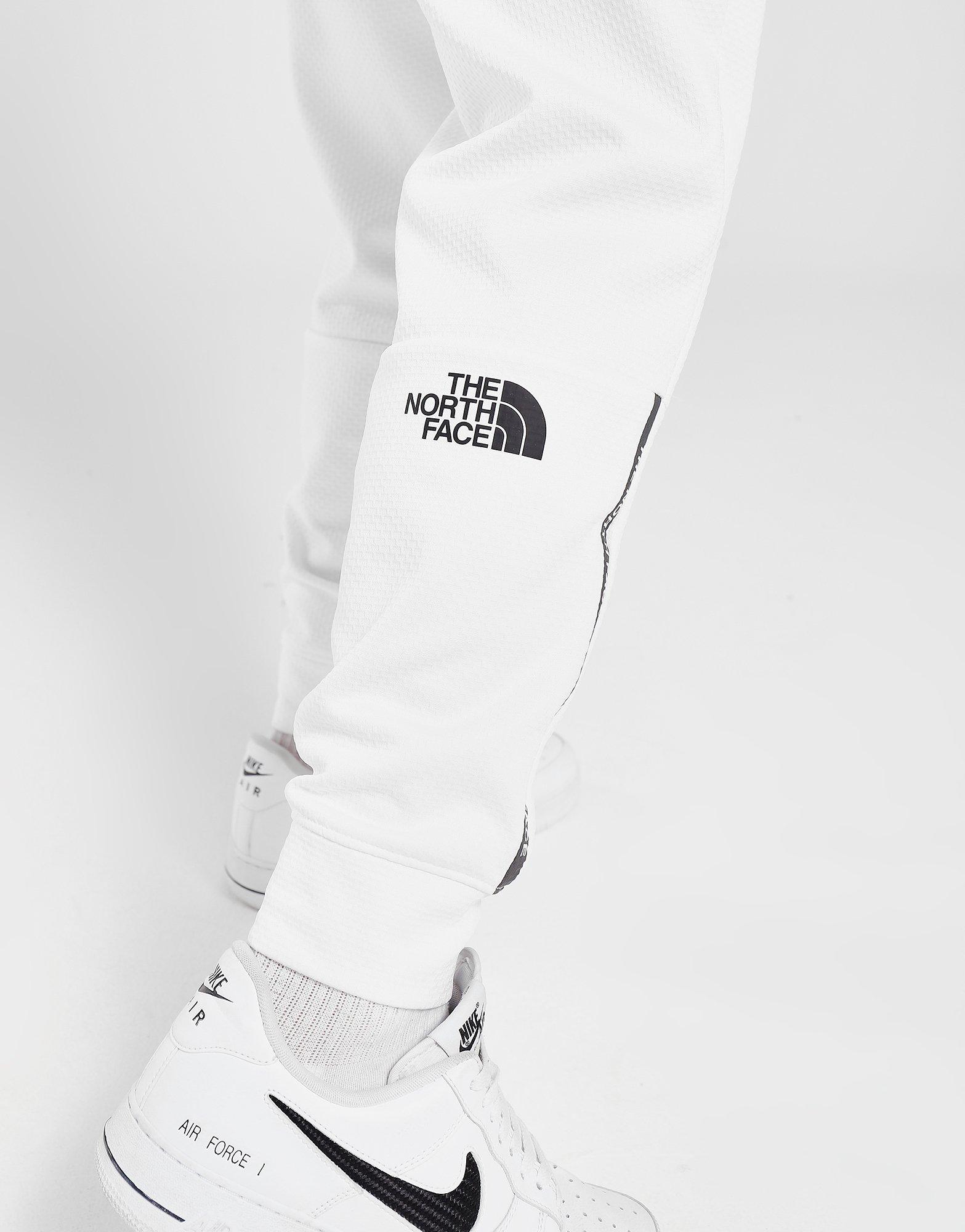 the north face train n logo track pants white