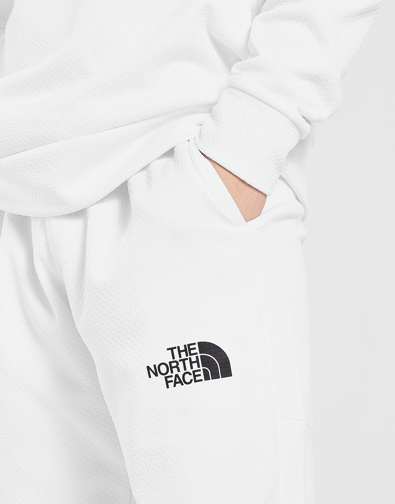 the north face train n logo track pants white