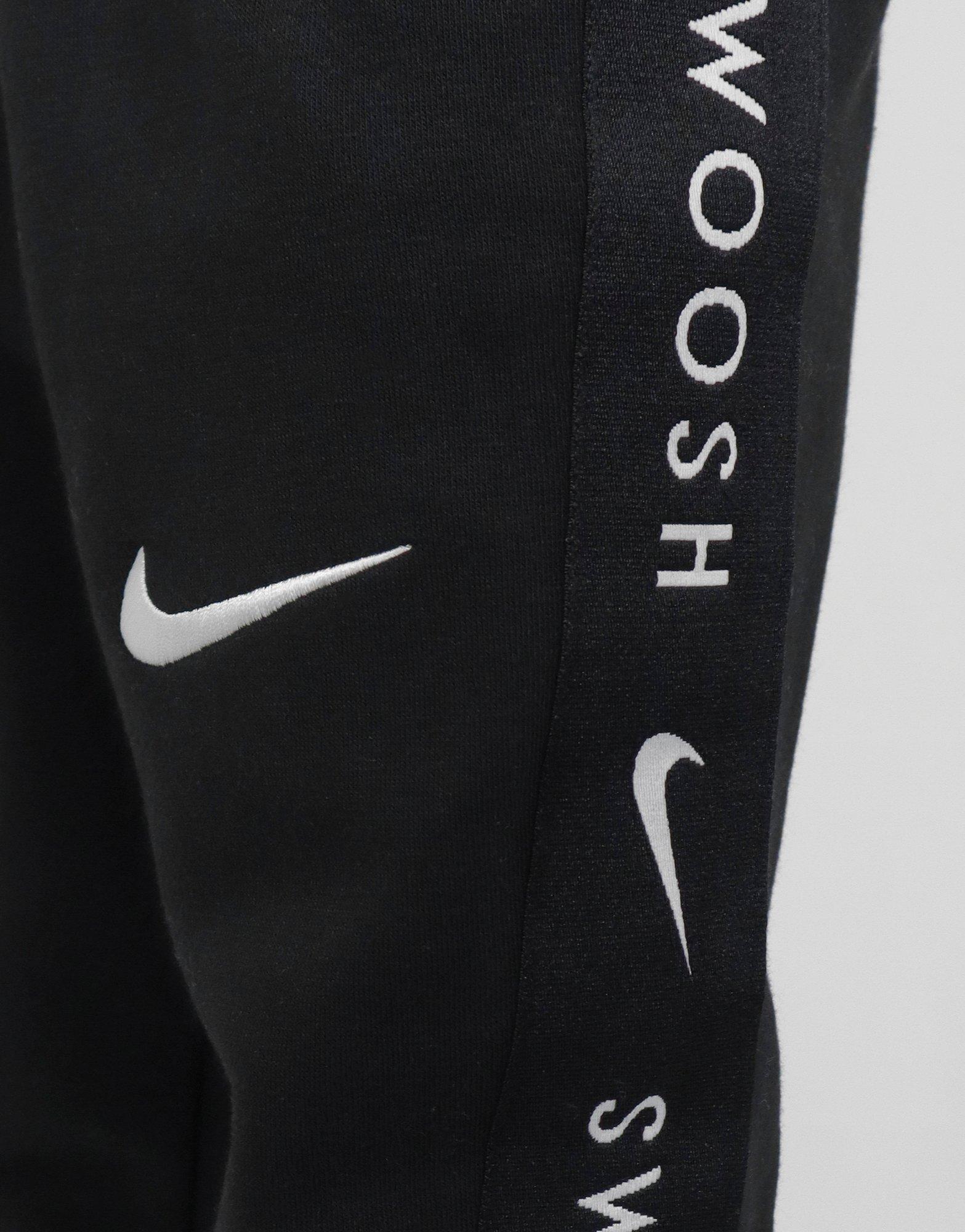 nike swoosh tracksuit