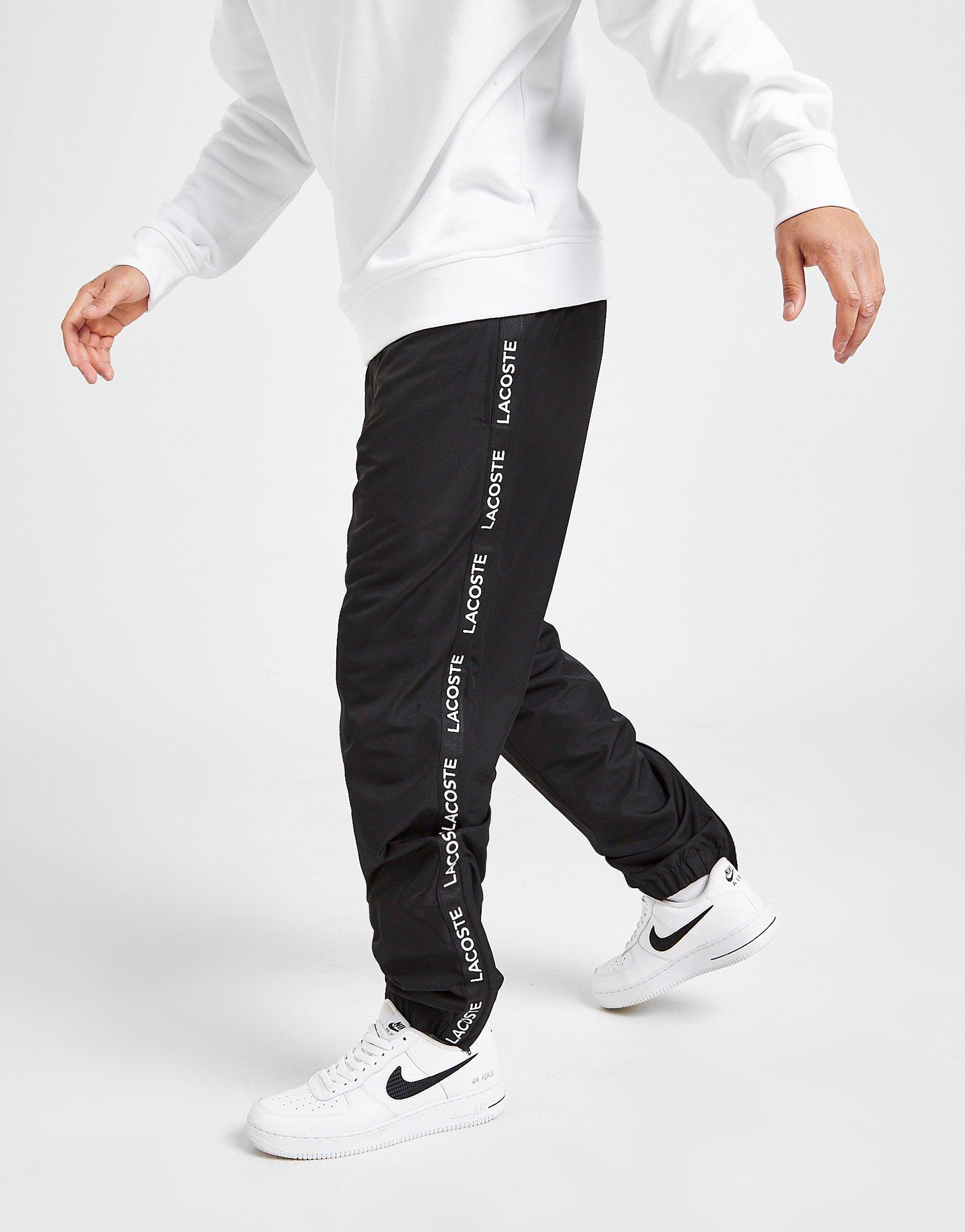 lacoste tape guppy track pants