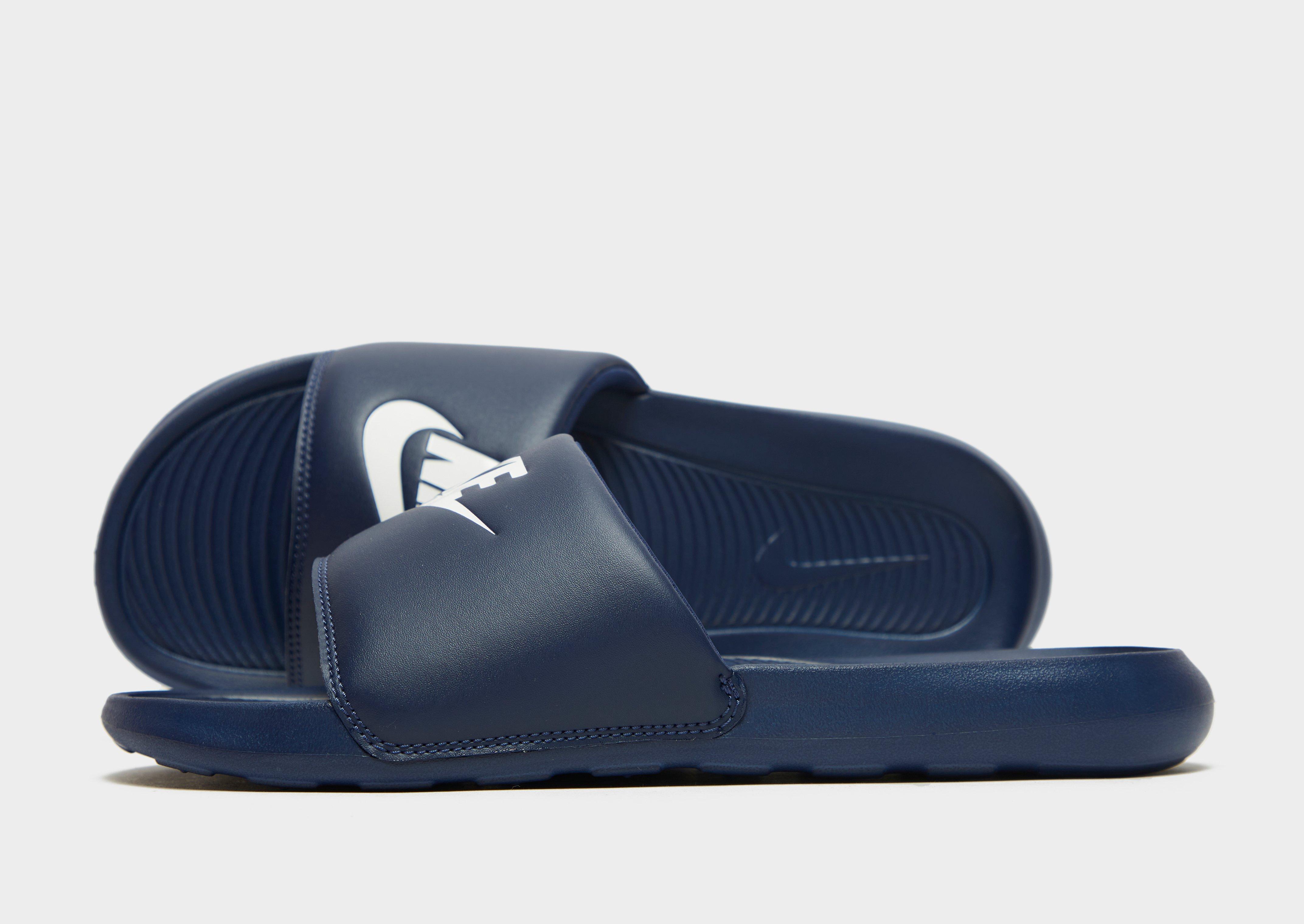 Nike navy sliders on sale