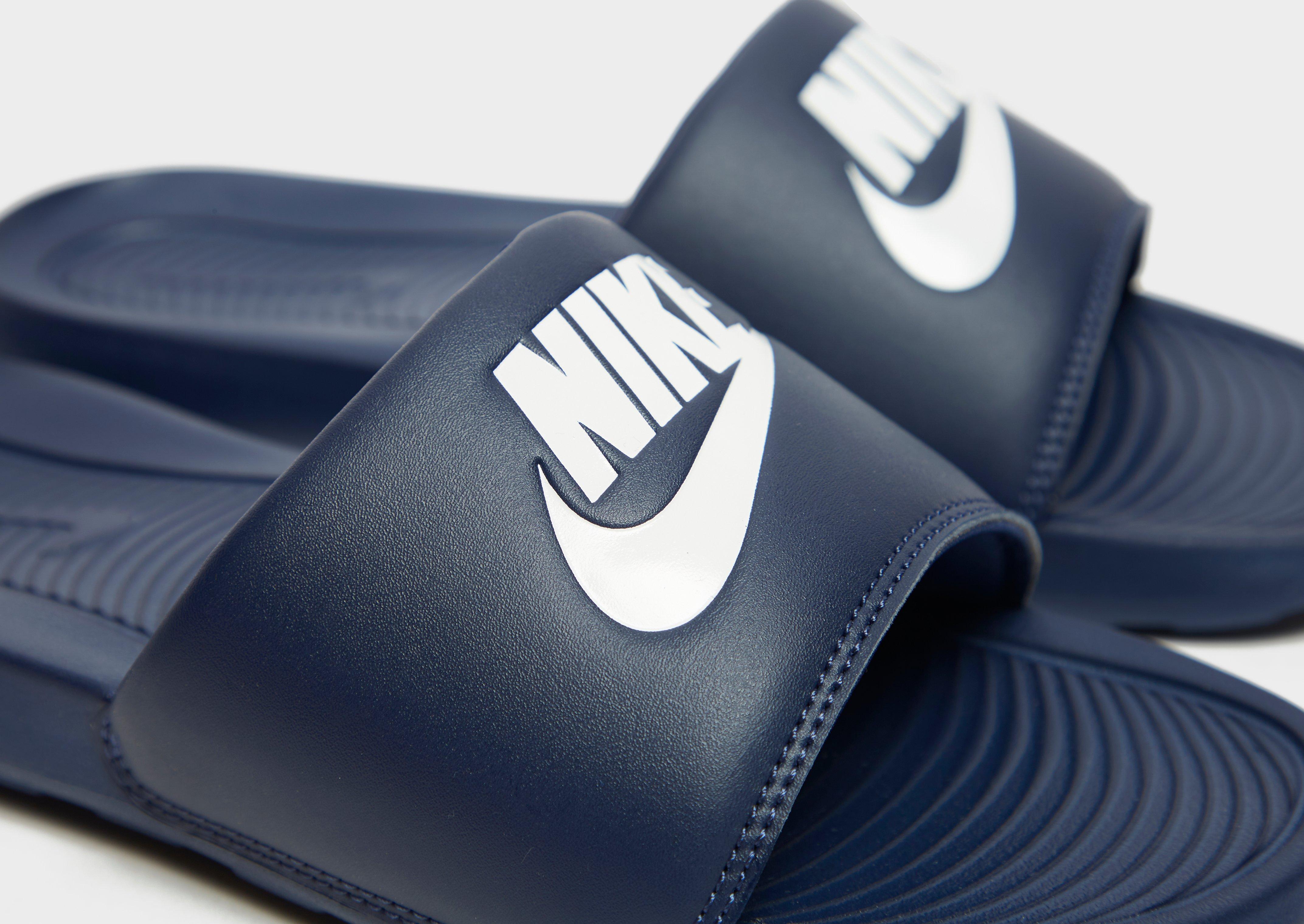 Navy blue nike slides hot sale