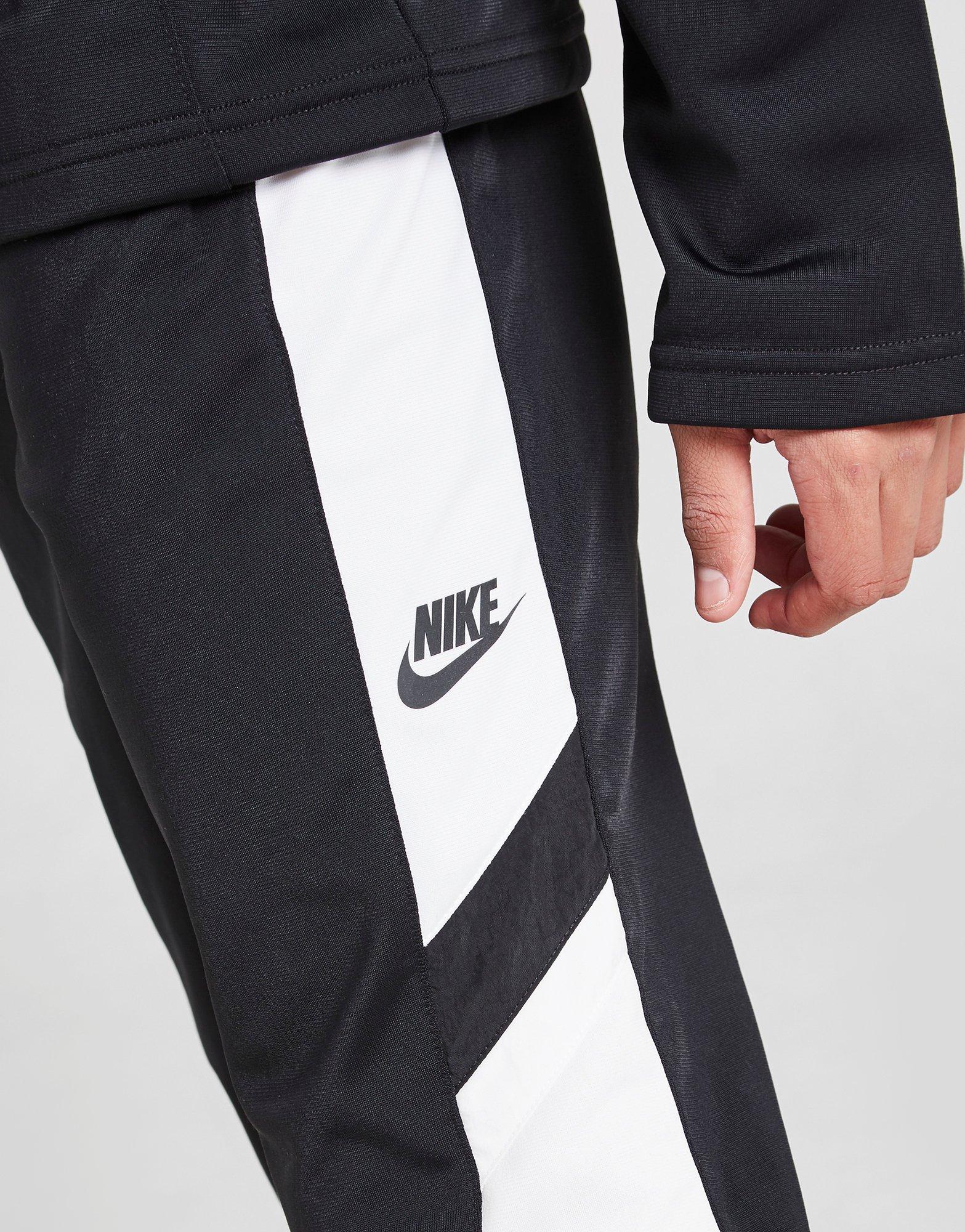 nike woven tracksuit junior