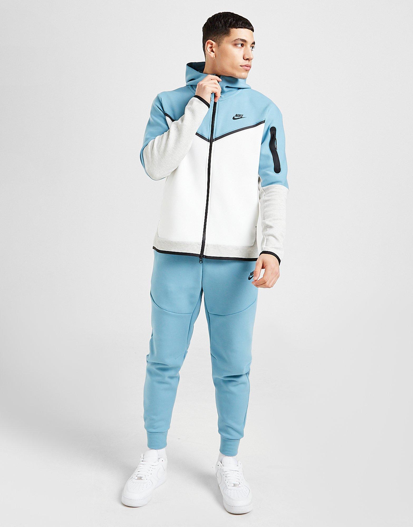 Nike tech fleece голубая. Nike Tech Fleece Blue White. Nike Tech Fleece голубая с белым. Nike Tech Fleece Tracksuit. Nike Tech Fleece Blue.