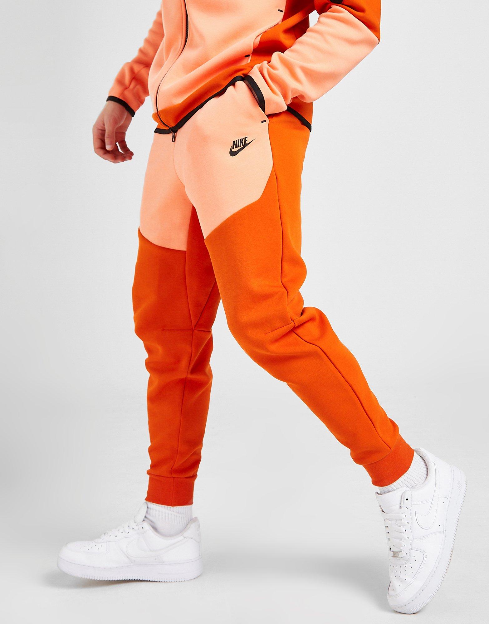 nike orange track pants
