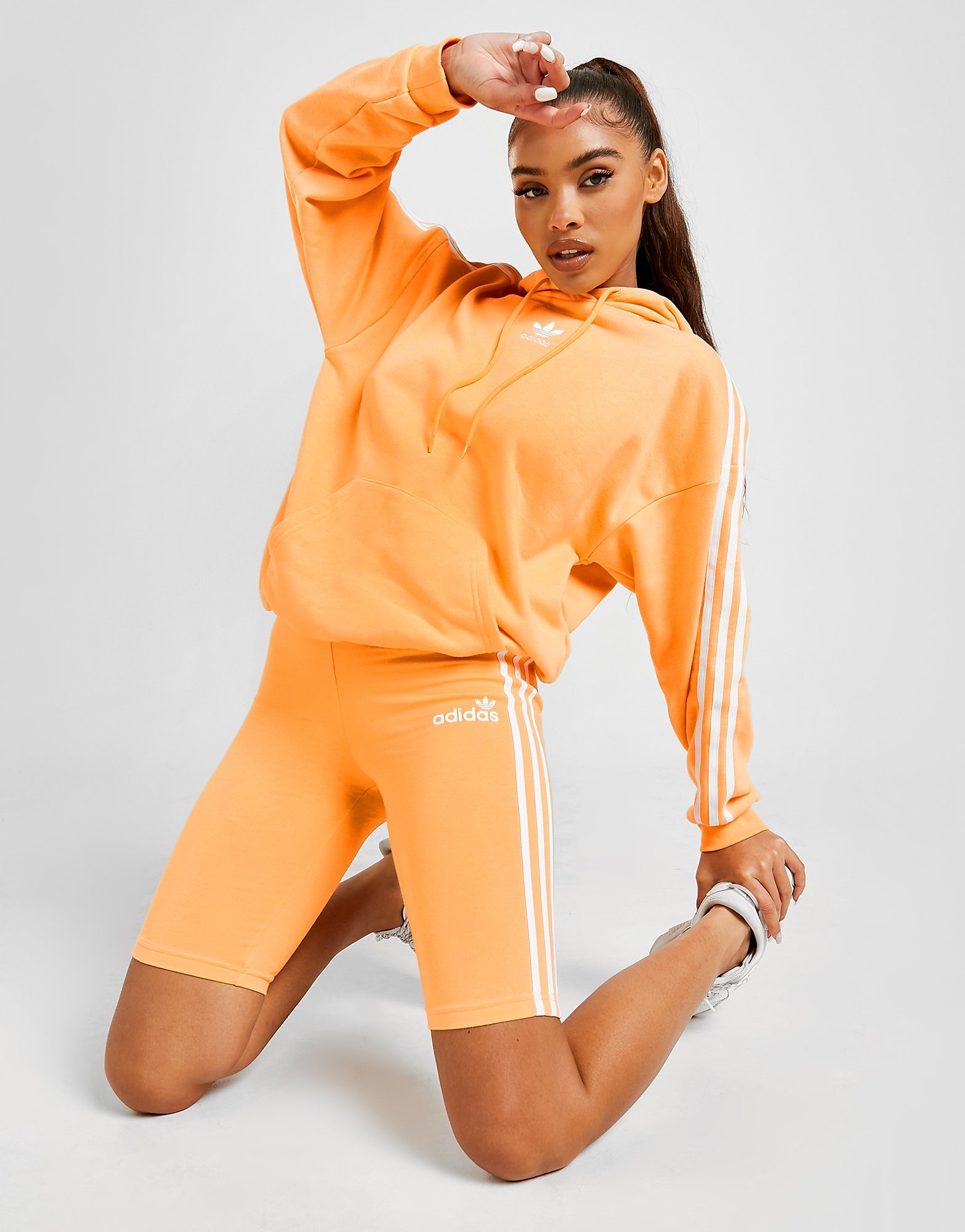 orange and white adidas shorts
