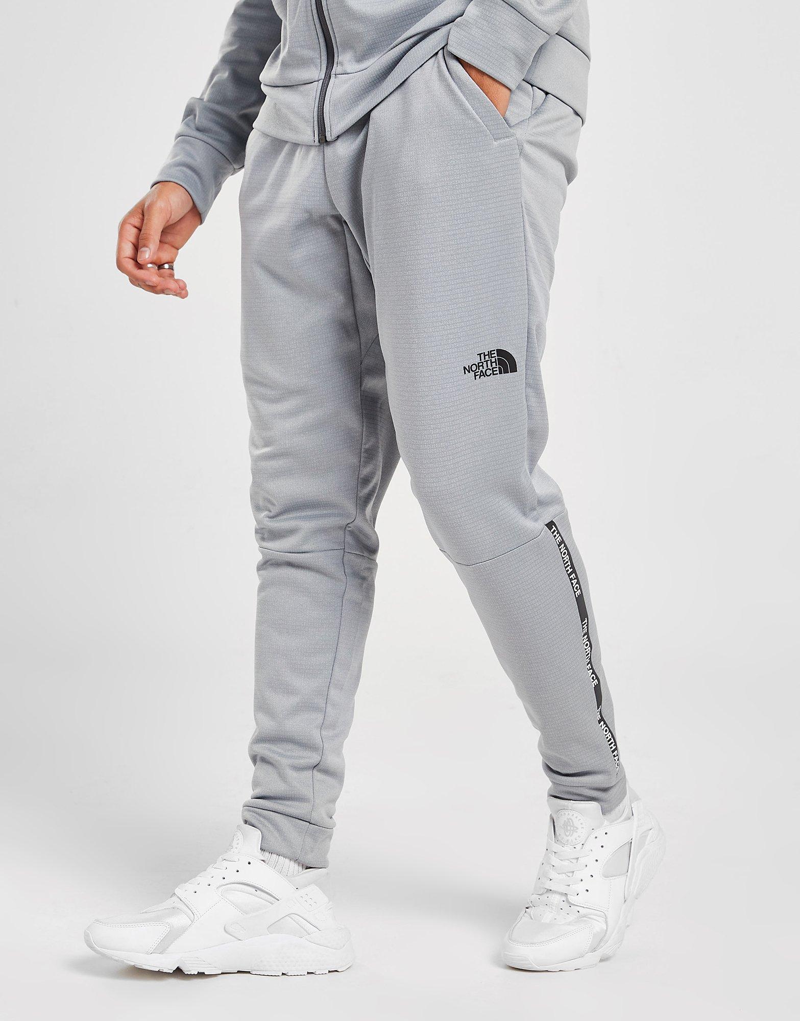 the north face train n logo track pants grey