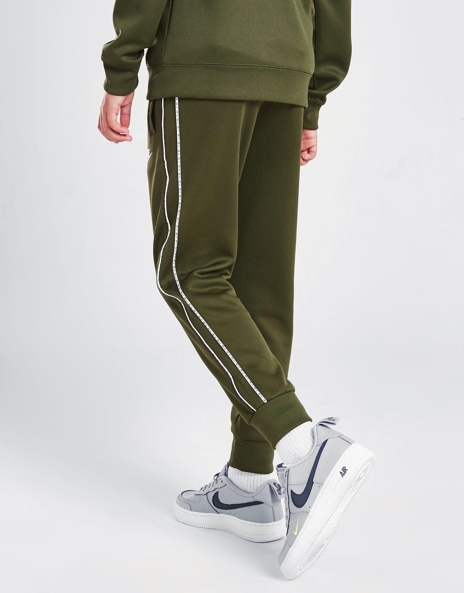 Nike tape poly shop track pants junior