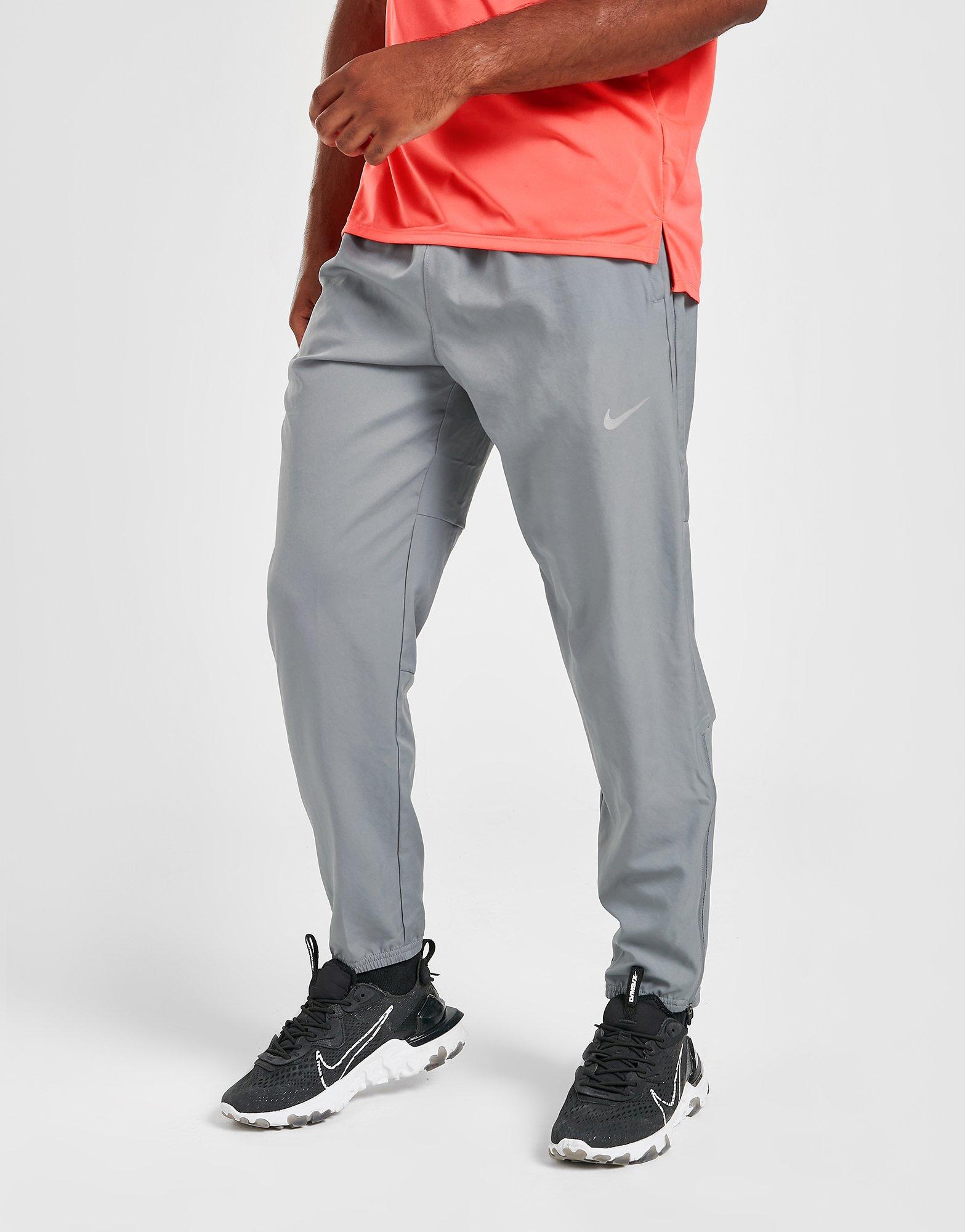 Nike Running Dri-Fit Challenger woven jogger in grey