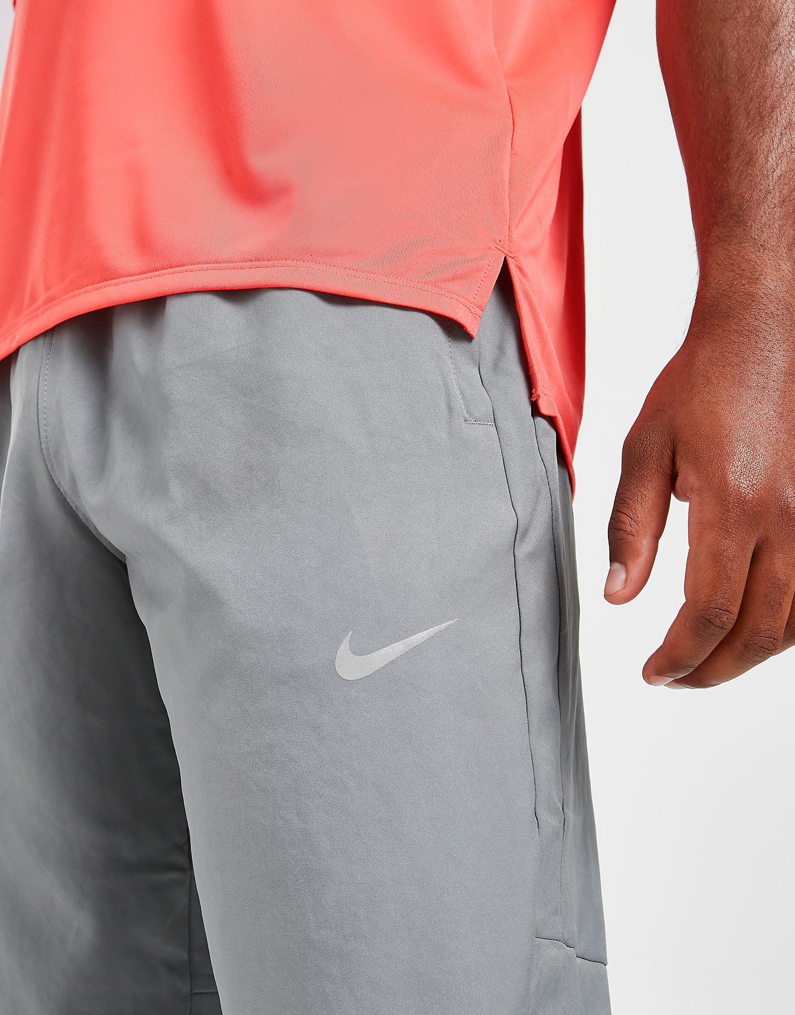 Nike Men Dri-Fit Challenger Woven Pants in Smoke Grey,Different