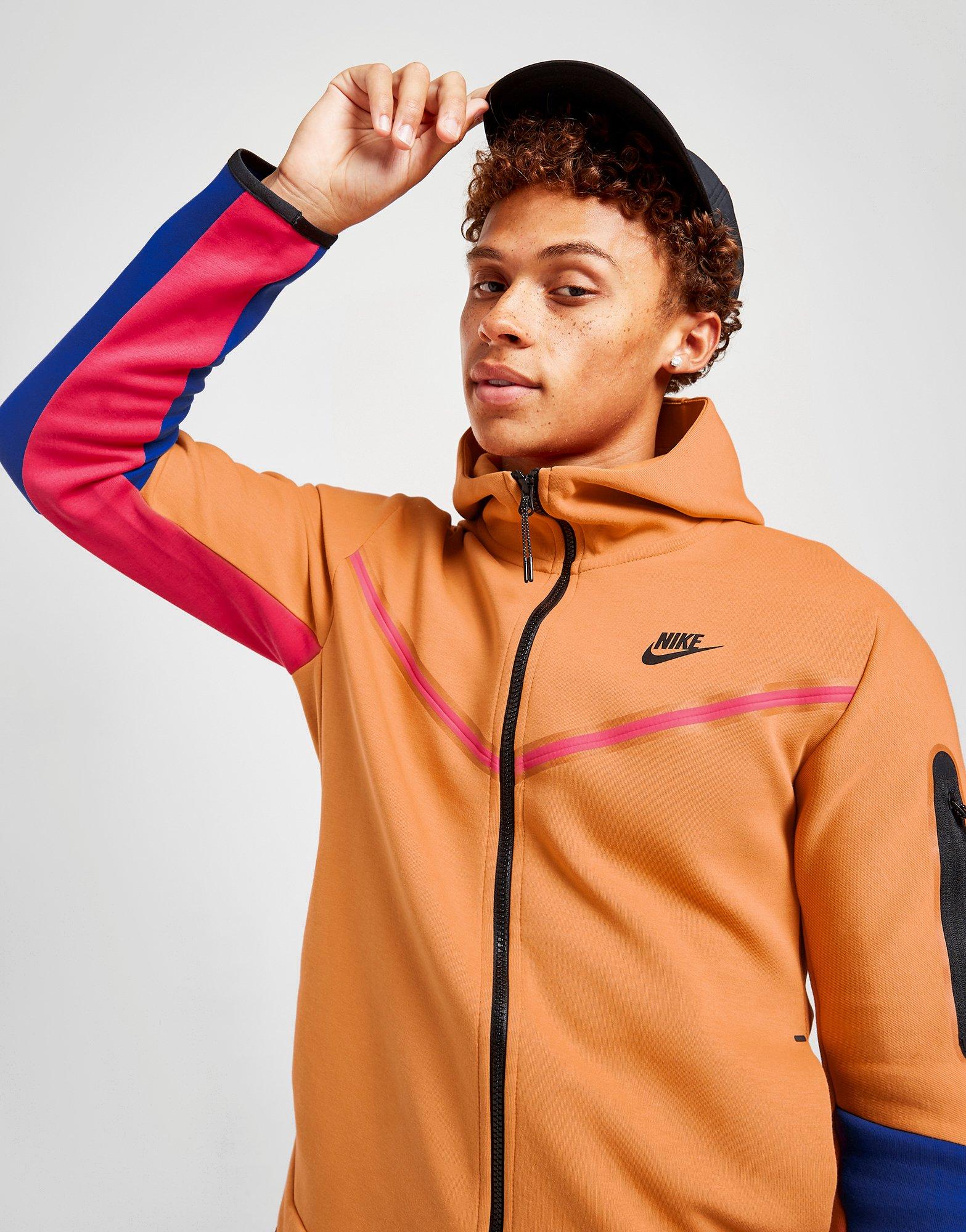 orange nike tech sweatsuit