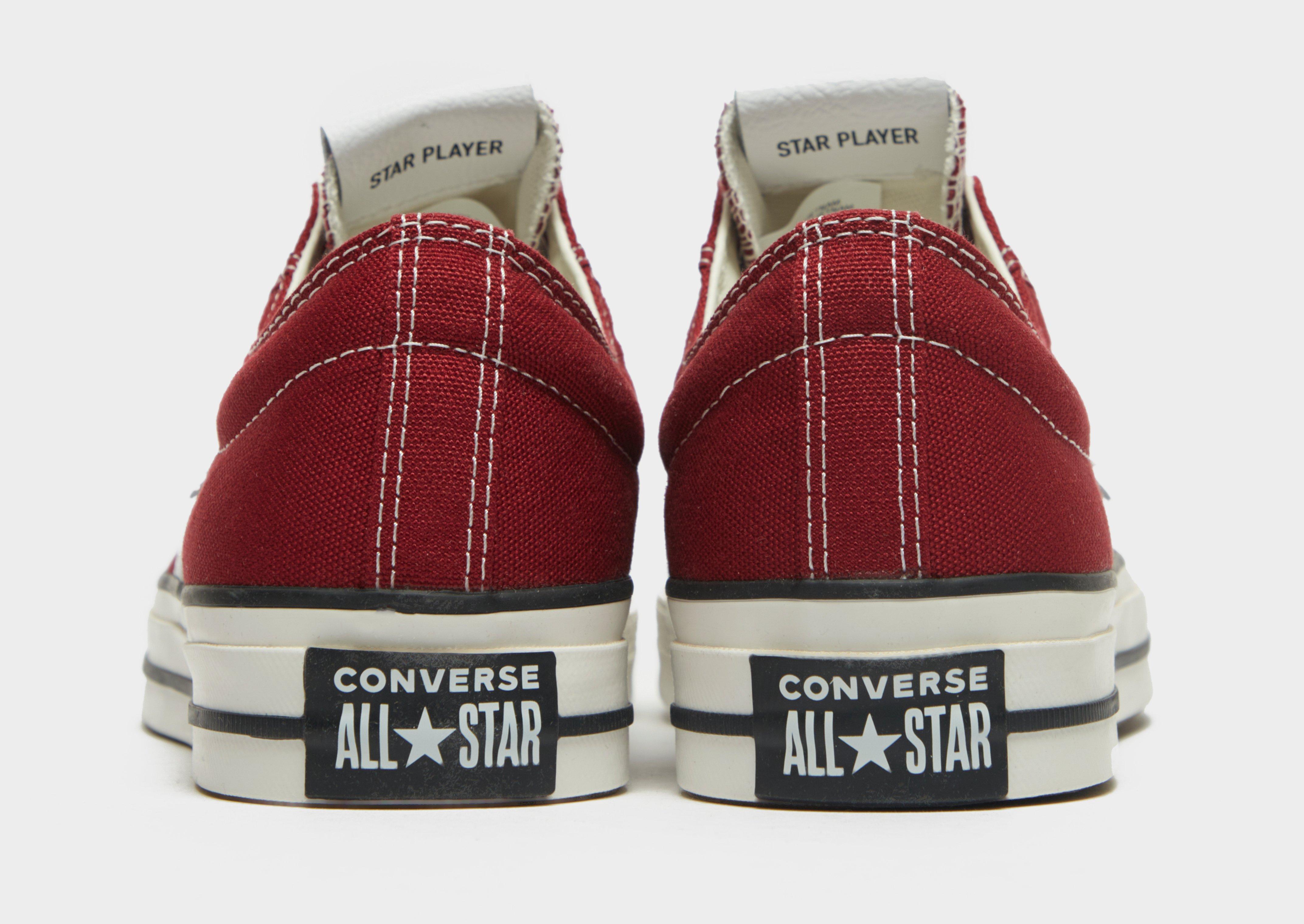 red converse star player