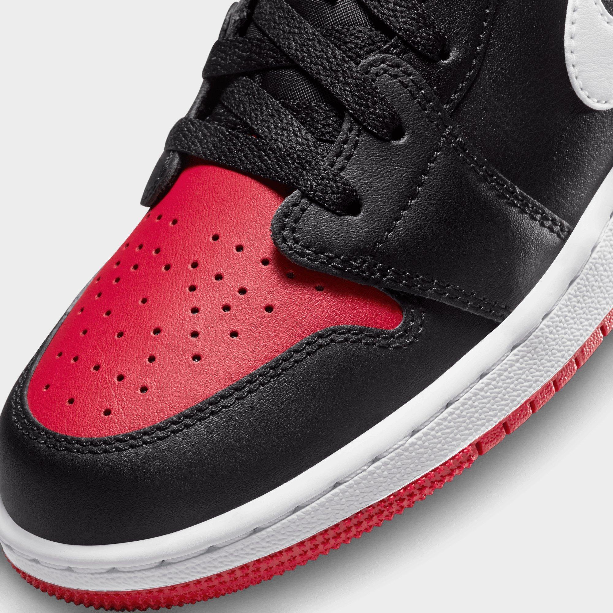 Low top black and red jordans best sale