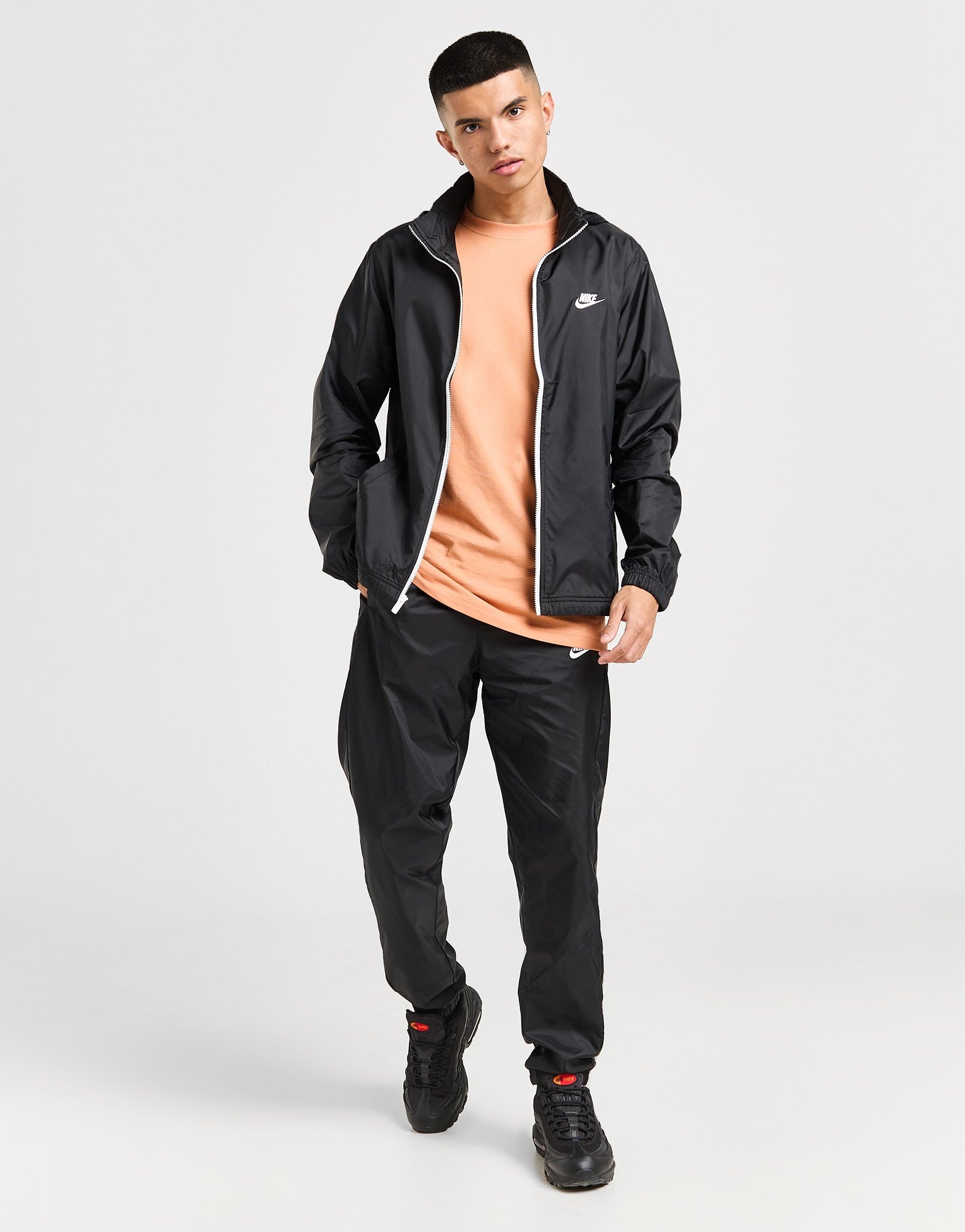 Nike woven tracksuit set in black hotsell