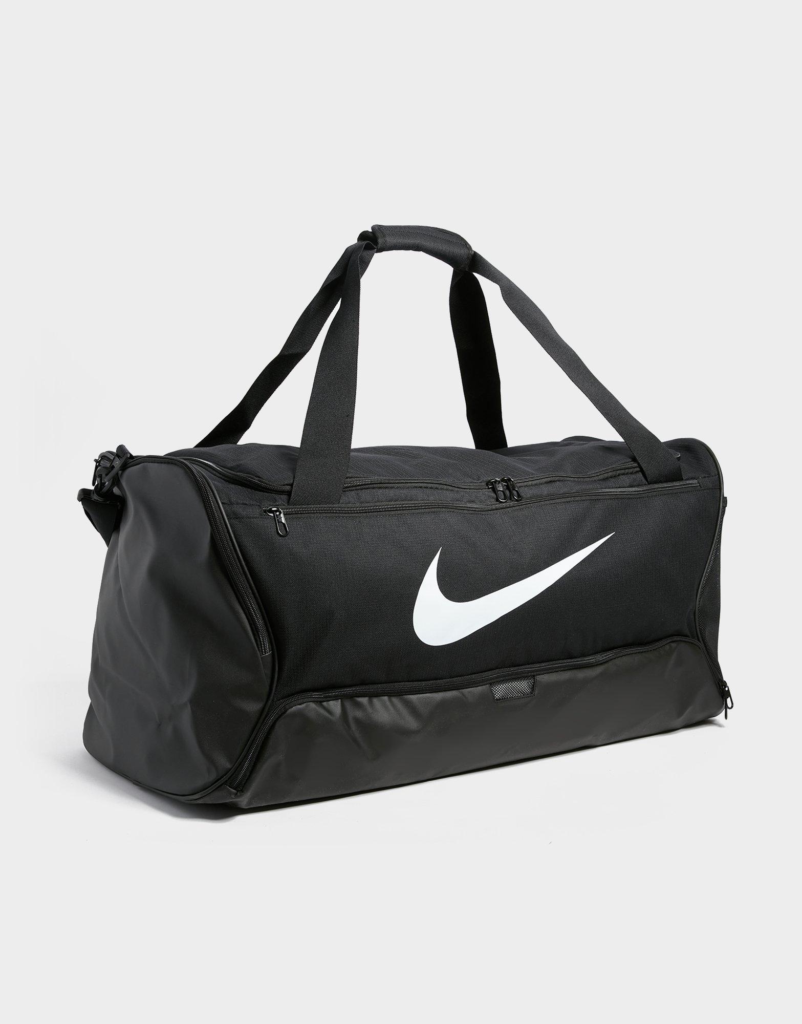 Nike Performance BRASILIA DUFFEL UNISEX - Sports bag - guava  ice/black/bright crimson/apricot 