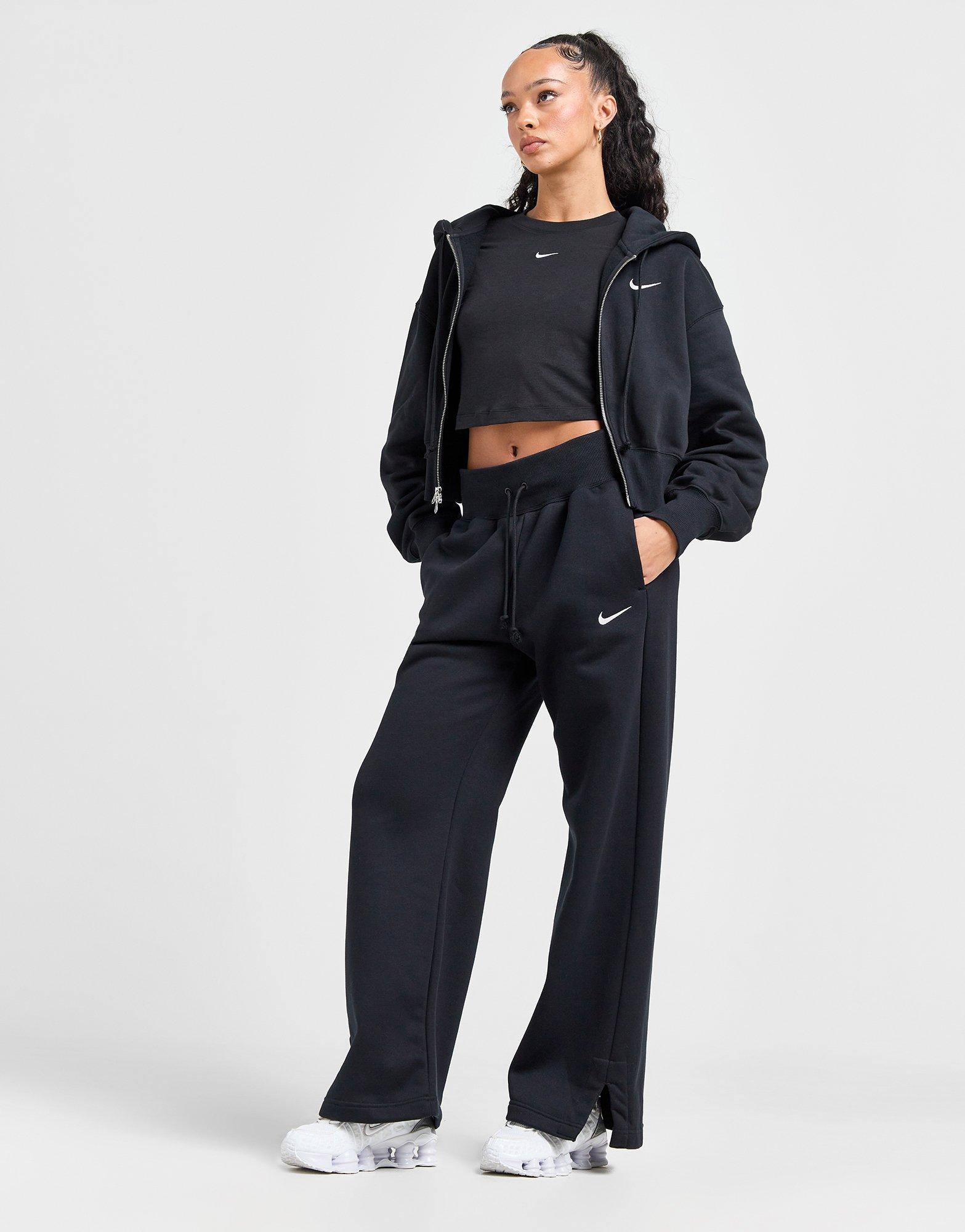 Nike oversized wide leg joggers in black - ShopStyle Activewear Trousers