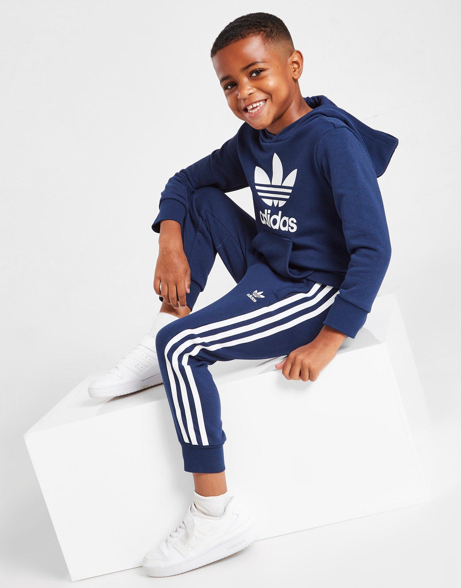 Blue and shop white adidas tracksuit