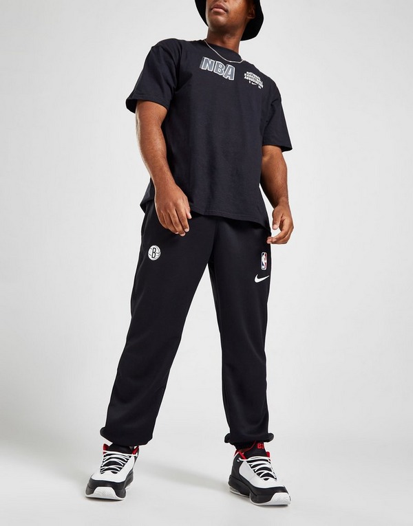 Nike pantalón de chándal Brooklyn Nets Spotlight en Negro | España