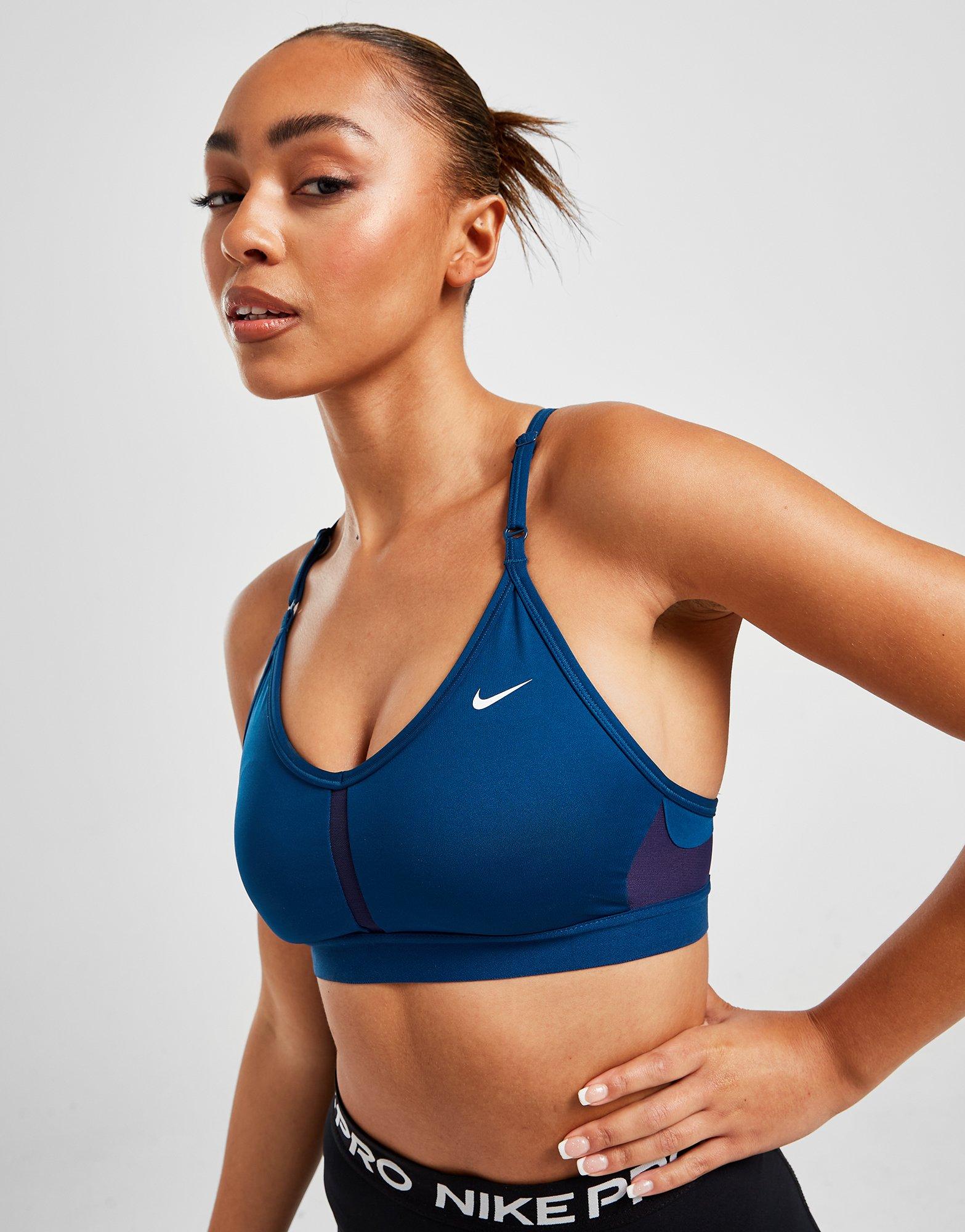 Woman wearing blue nike sports bra