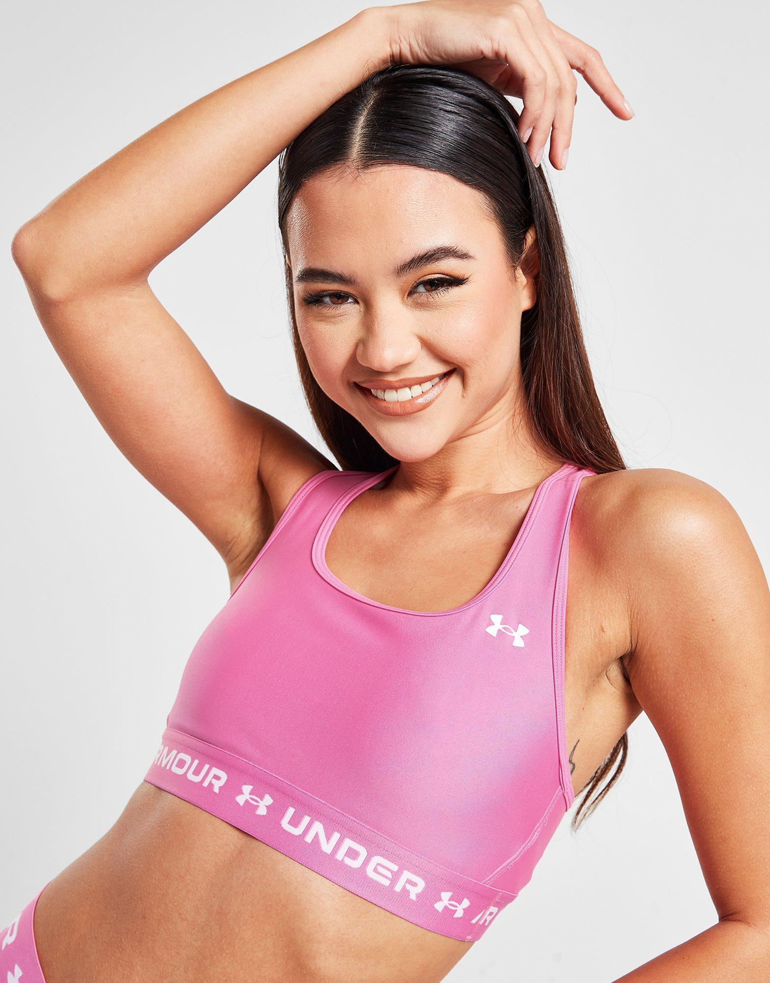 High tech never looked so fun. The Under Armour HeatGear Logo Band Sports  Bra in Pink Edge brings next level comfort in summer ready pink. 💗