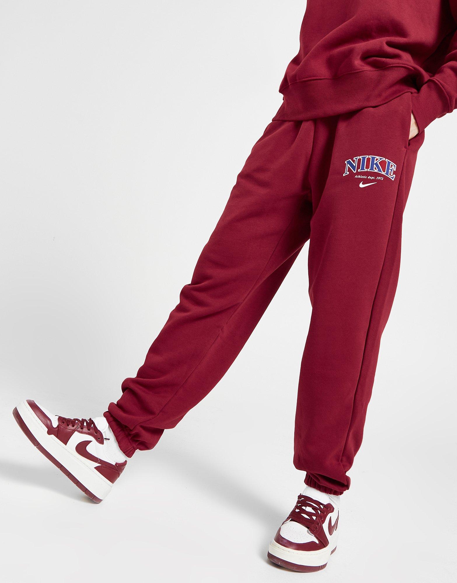 Nike Varsity Joggers in Red