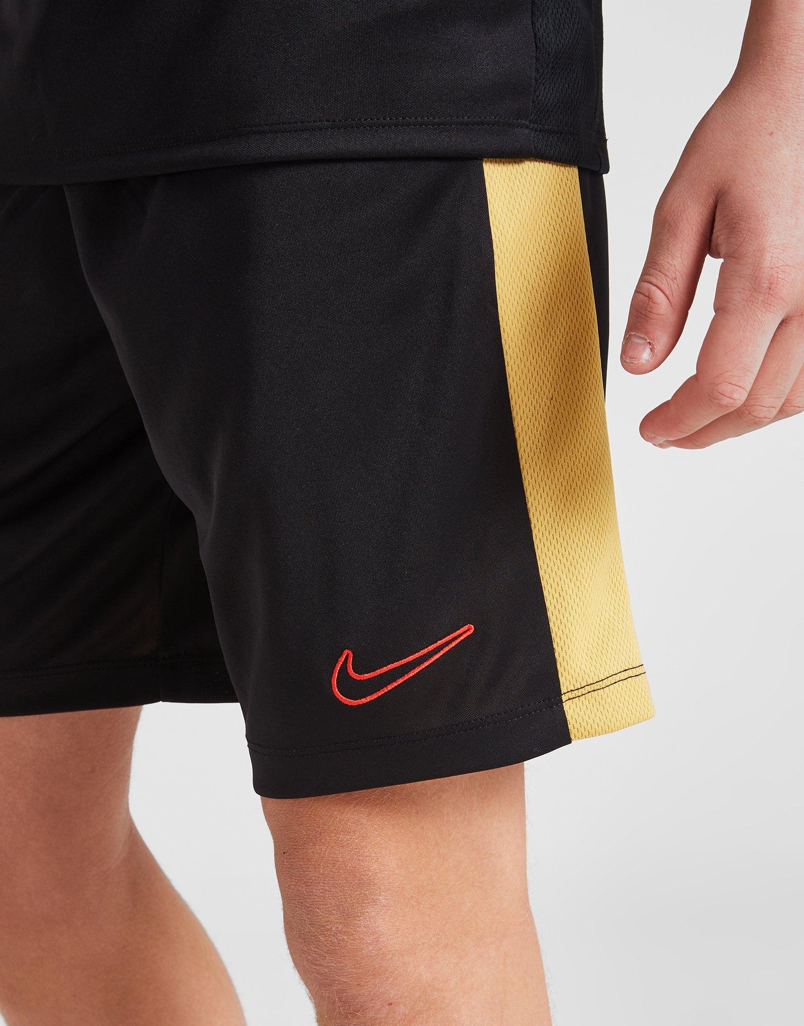 Black and outlet gold nike shorts