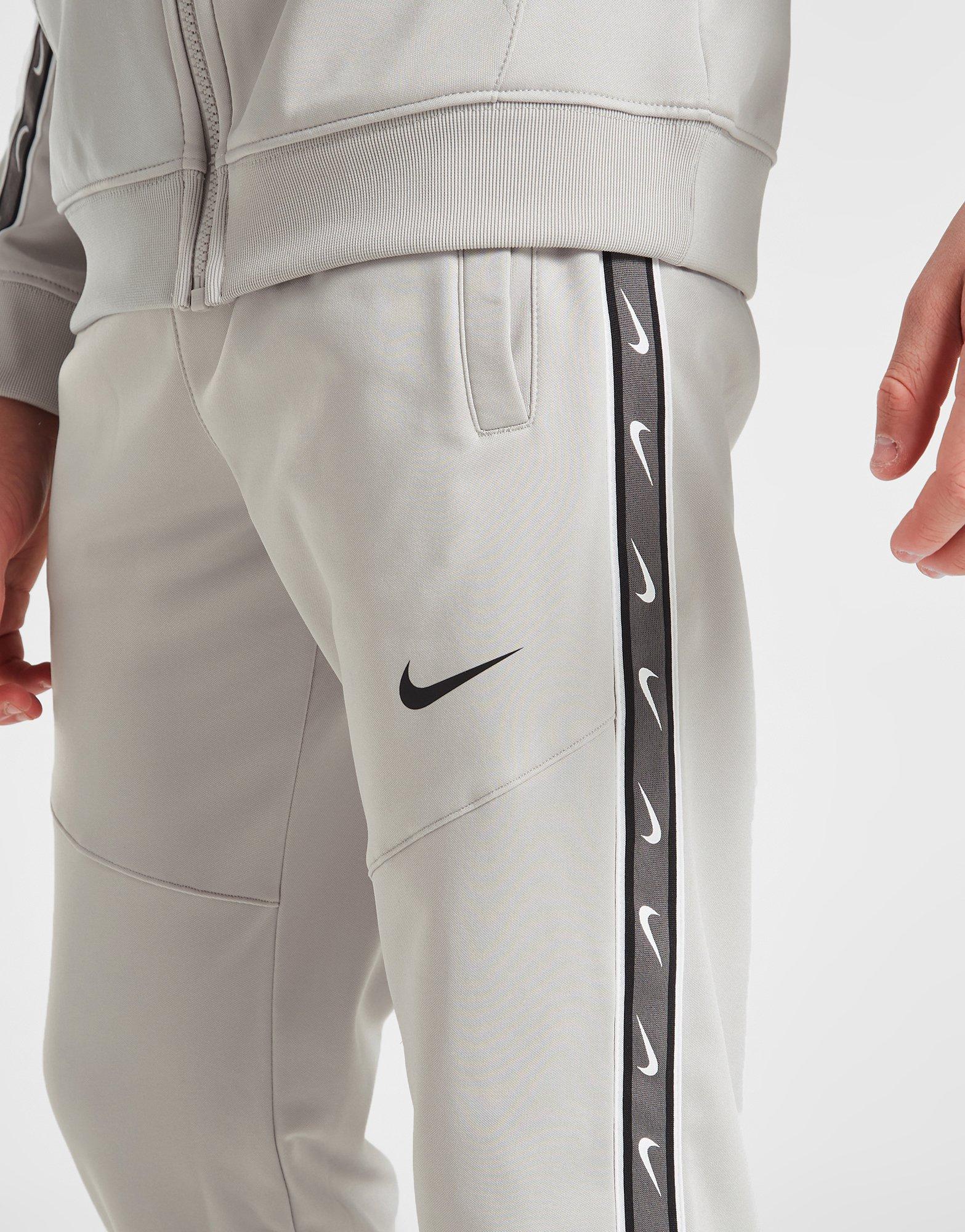 Nike tape store poly joggers junior