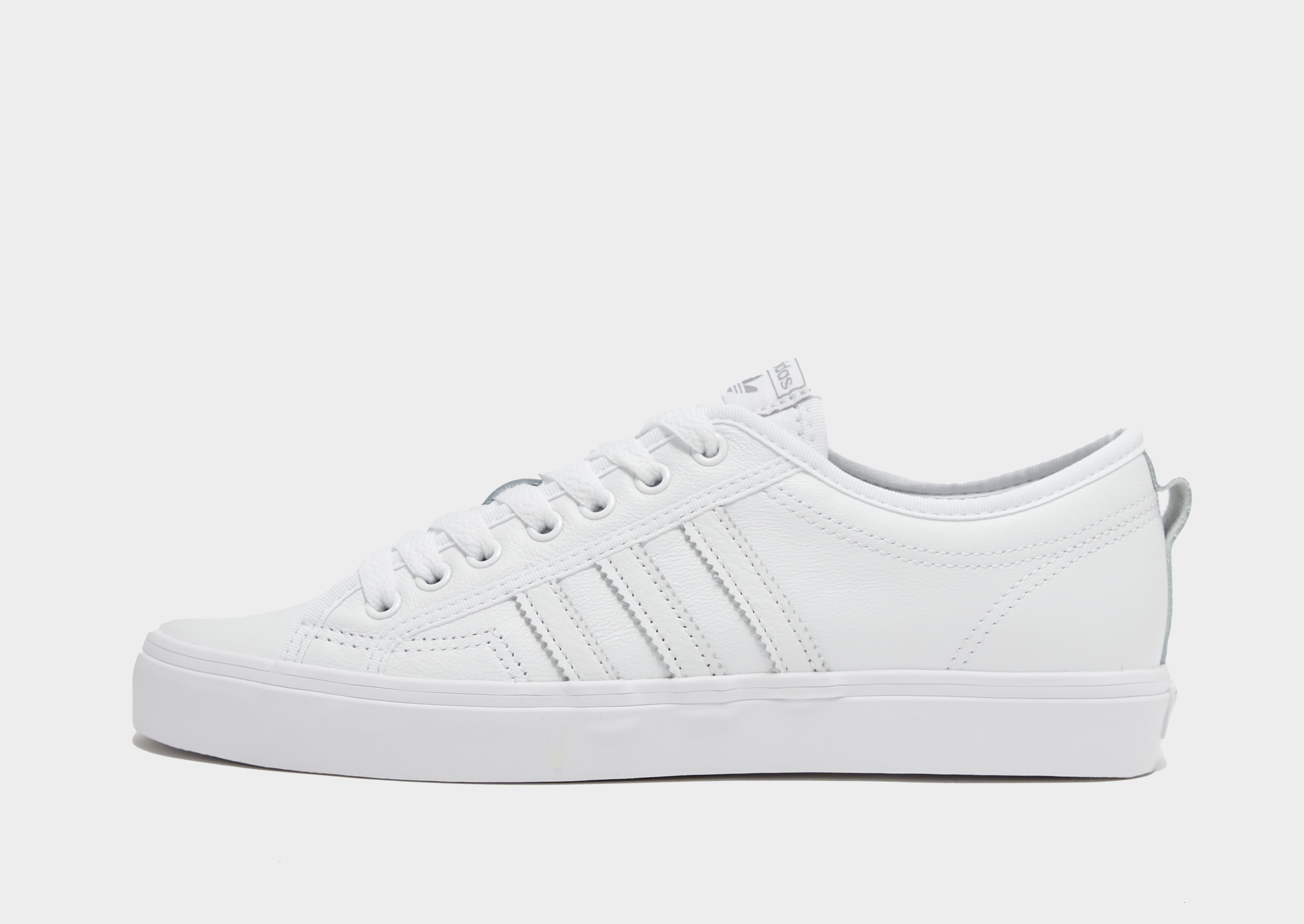 Adidas originals white on sale and black nizza sneakers