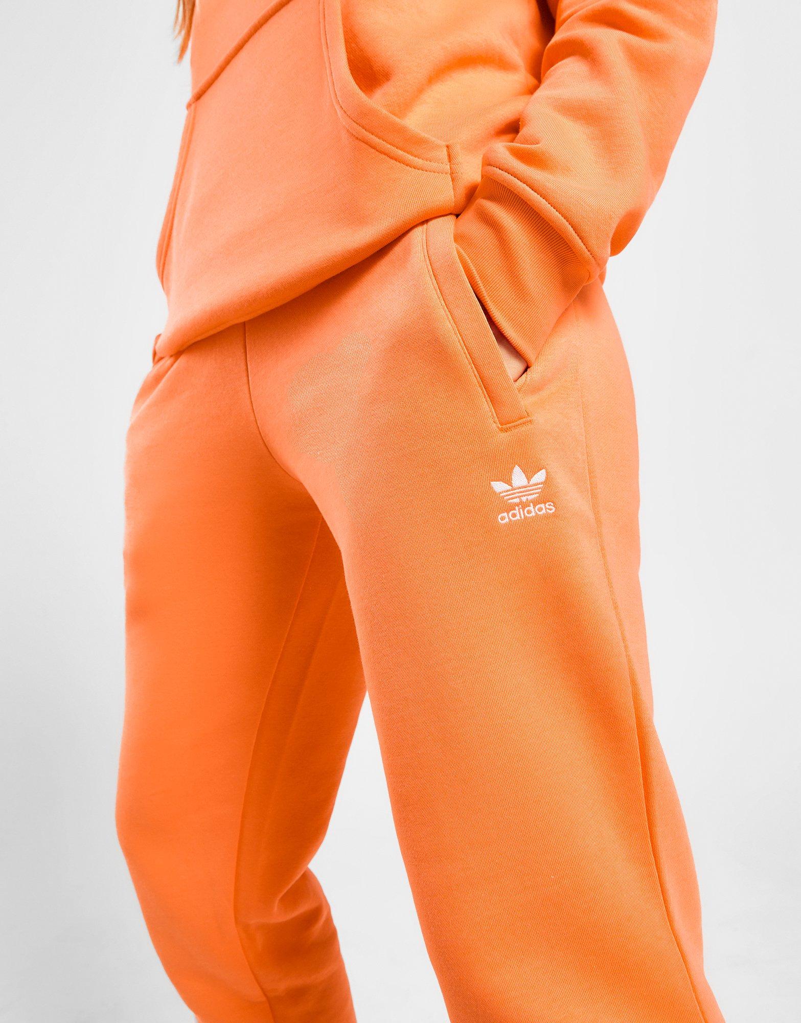 auricular Amplia gama alquiler adidas Originals pantalón de chándal Essential Slim Fleece en Naranja | JD  Sports España
