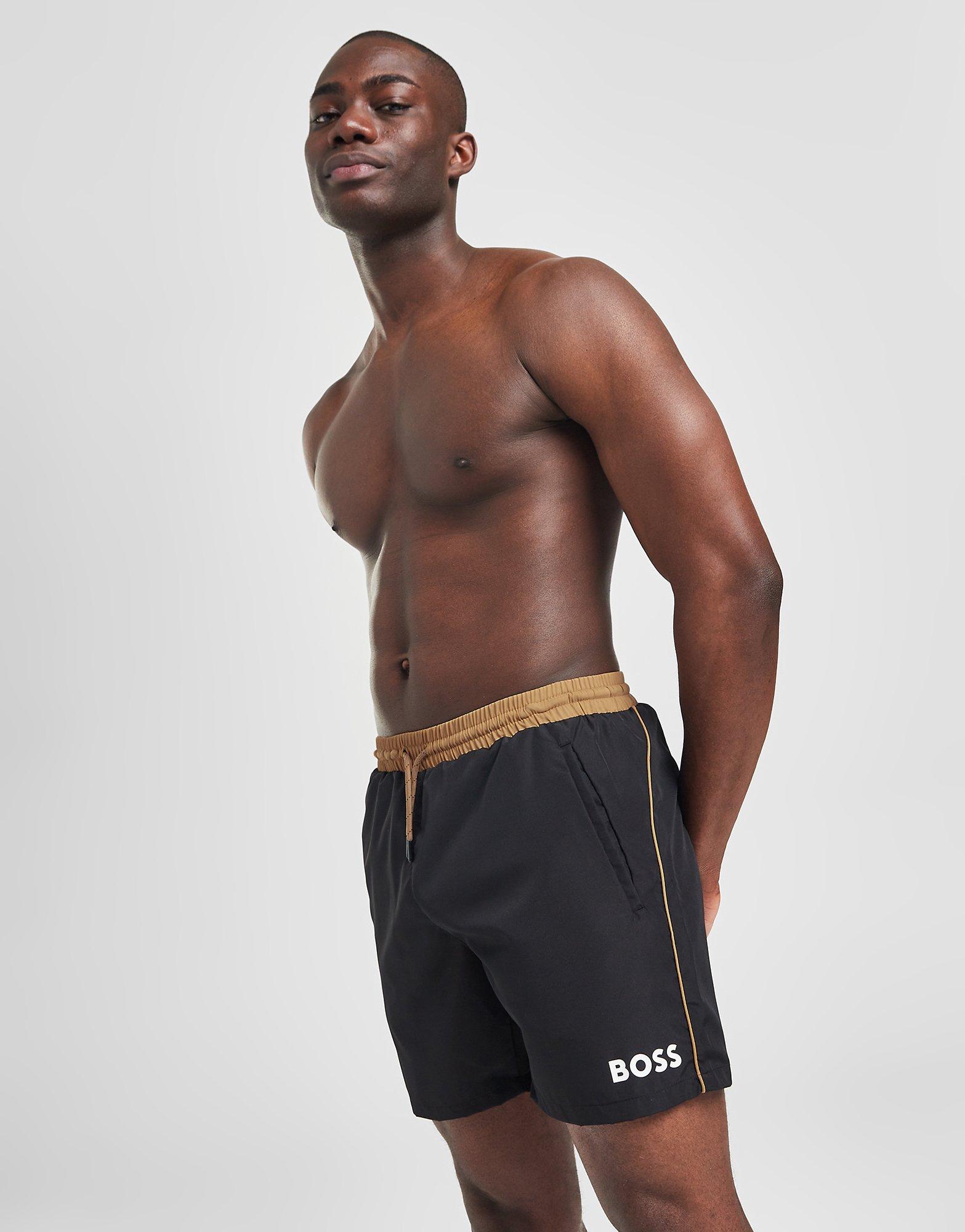 Black and store gold swim trunks